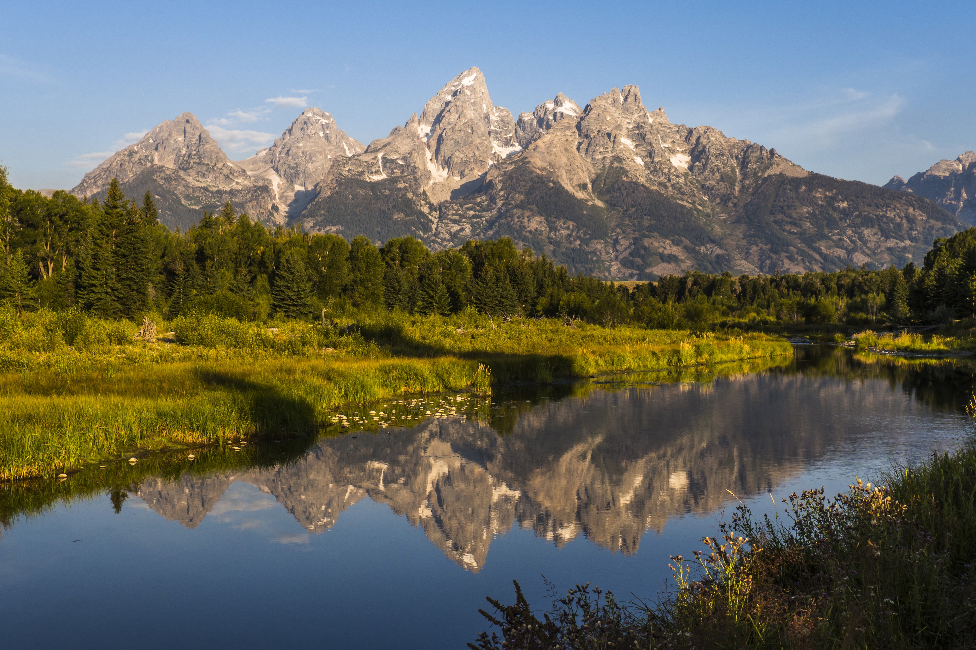 Grand Teton Mountains reflected in a river HD Wallpaper