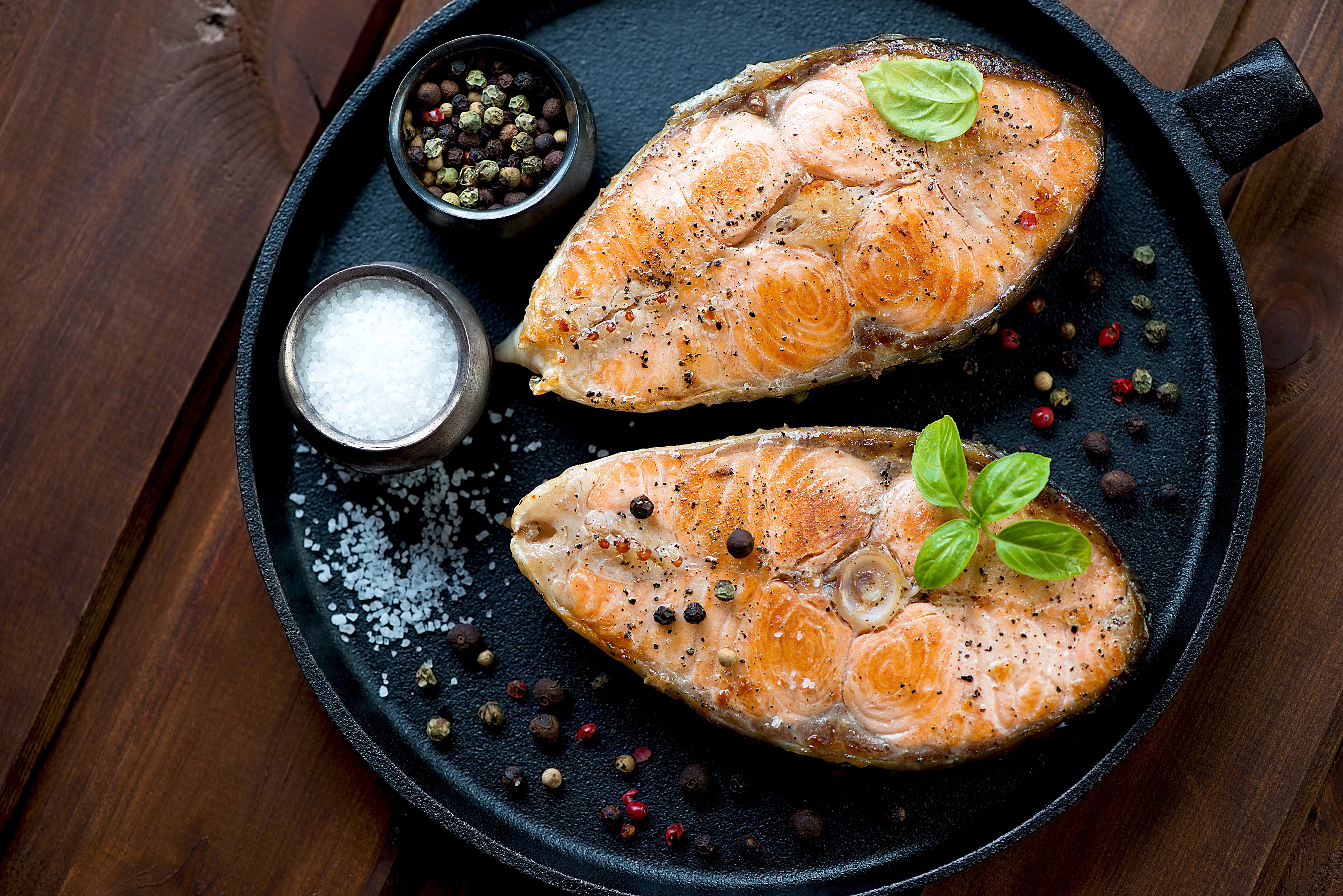Two salmon steaks with salt and pepper HD Wallpaper