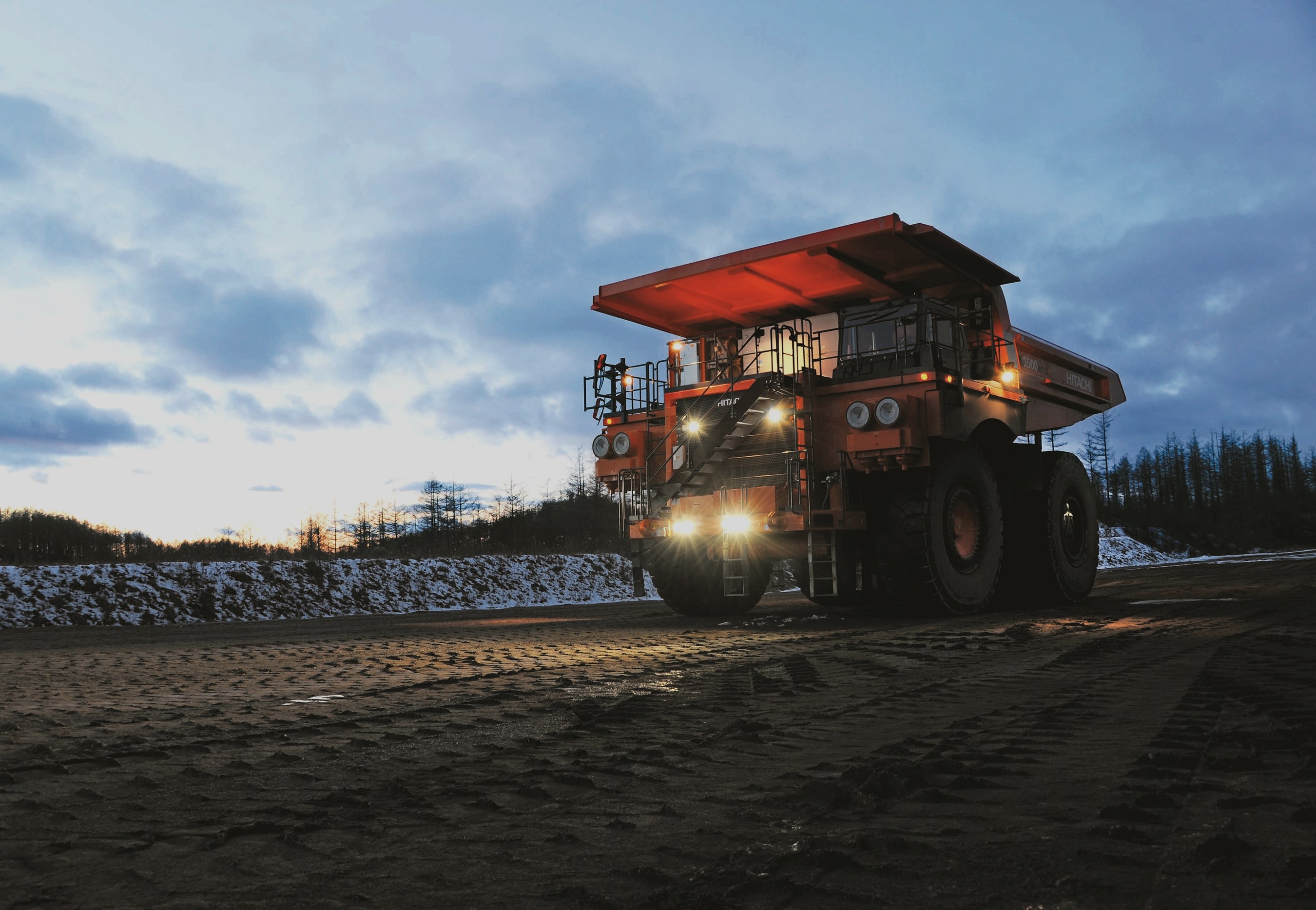 Hitachi EH3500ACII mining truck at dusk HD Wallpaper