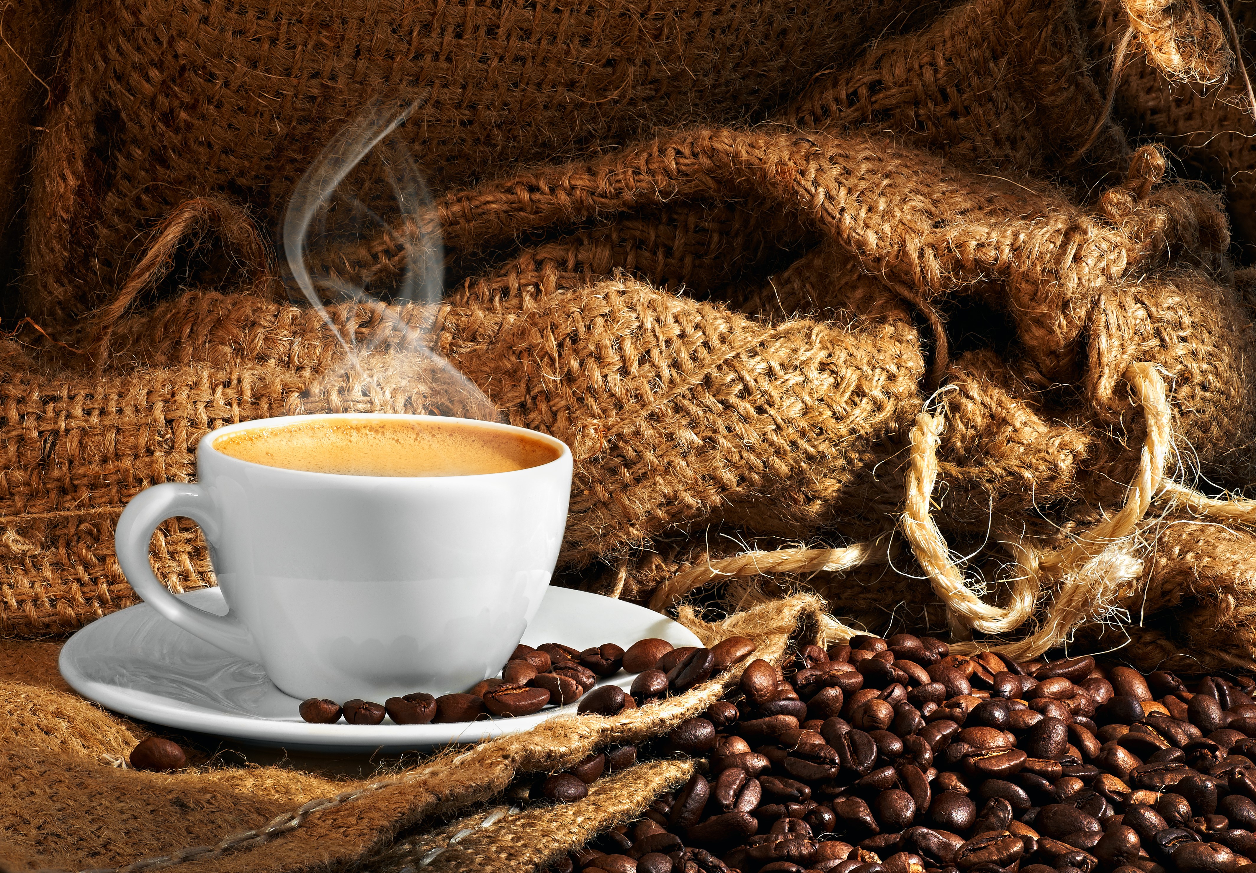 Coffee cup with steam and coffee beans on burlap HD Wallpaper
