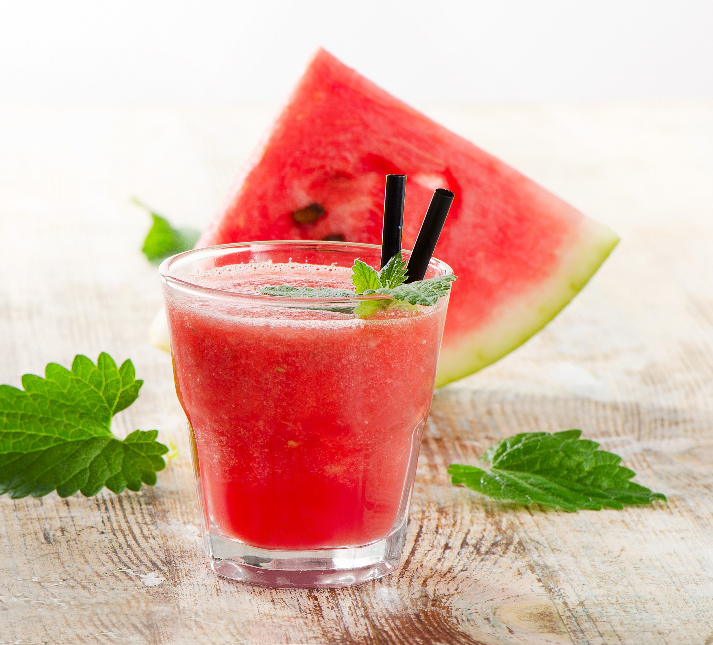 Watermelon juice in a glass with mint and watermelon slice HD Wallpaper