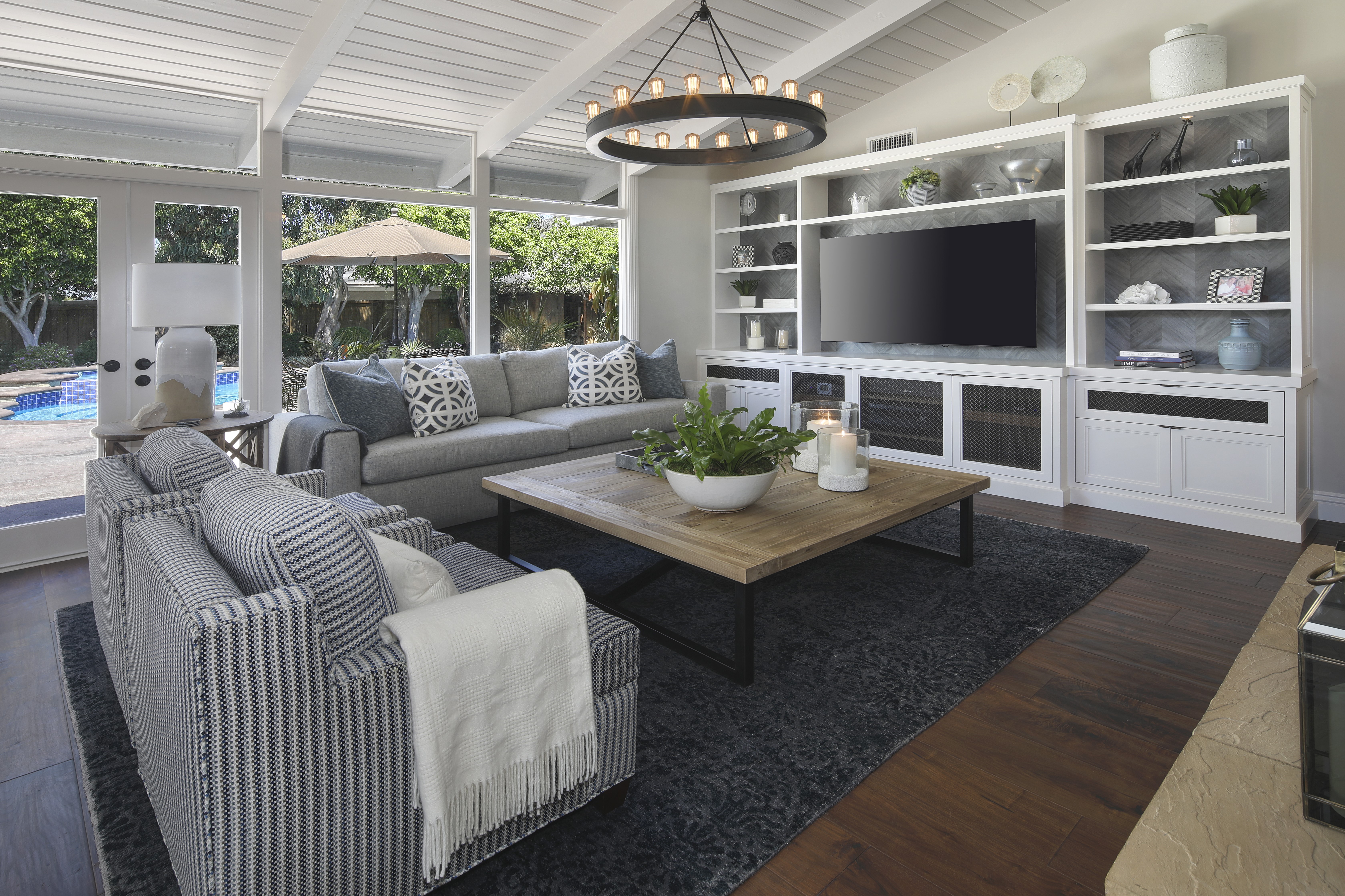Living room with sofa and entertainment center HD Wallpaper