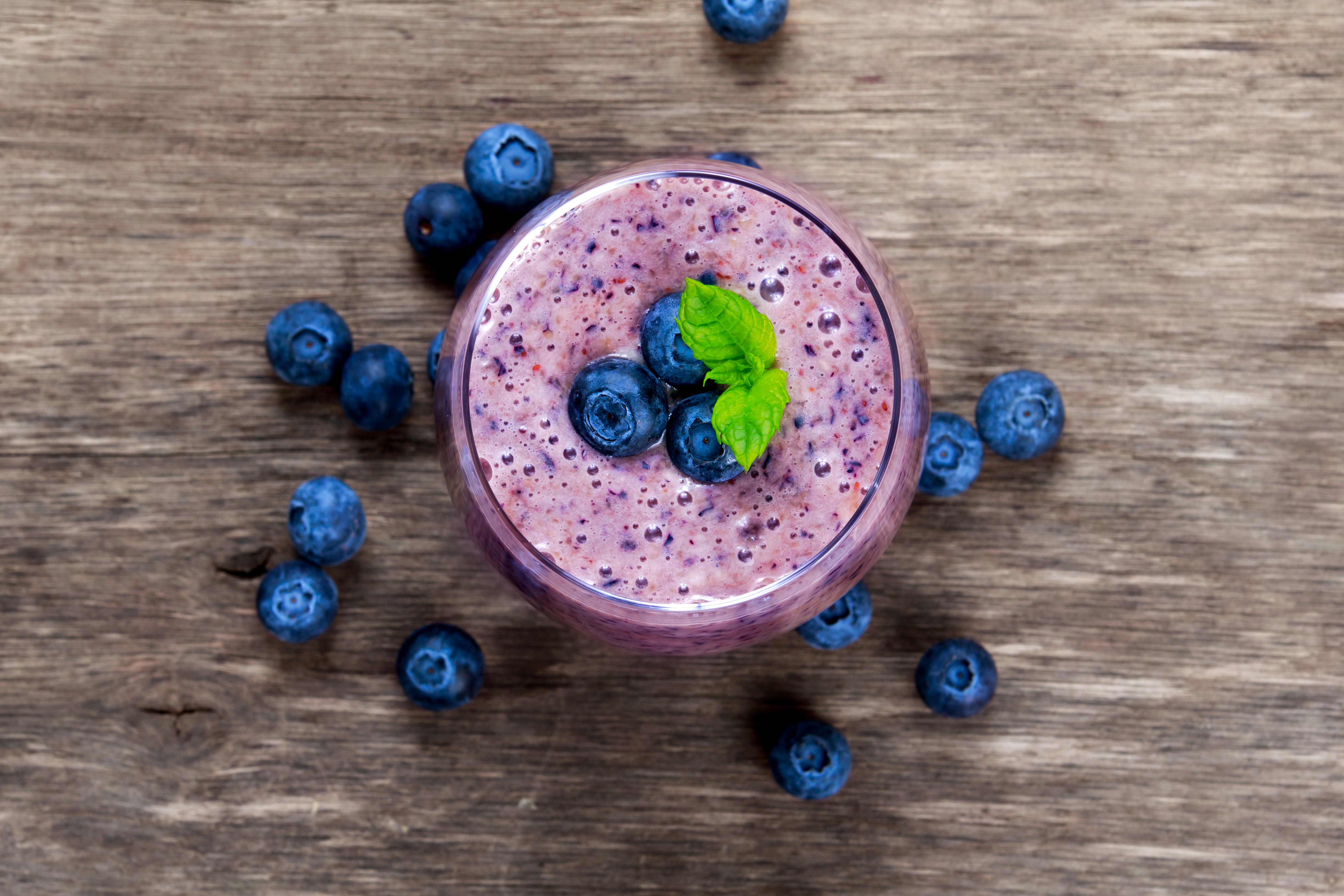 Blueberry smoothie in a glass with blueberries HD Wallpaper