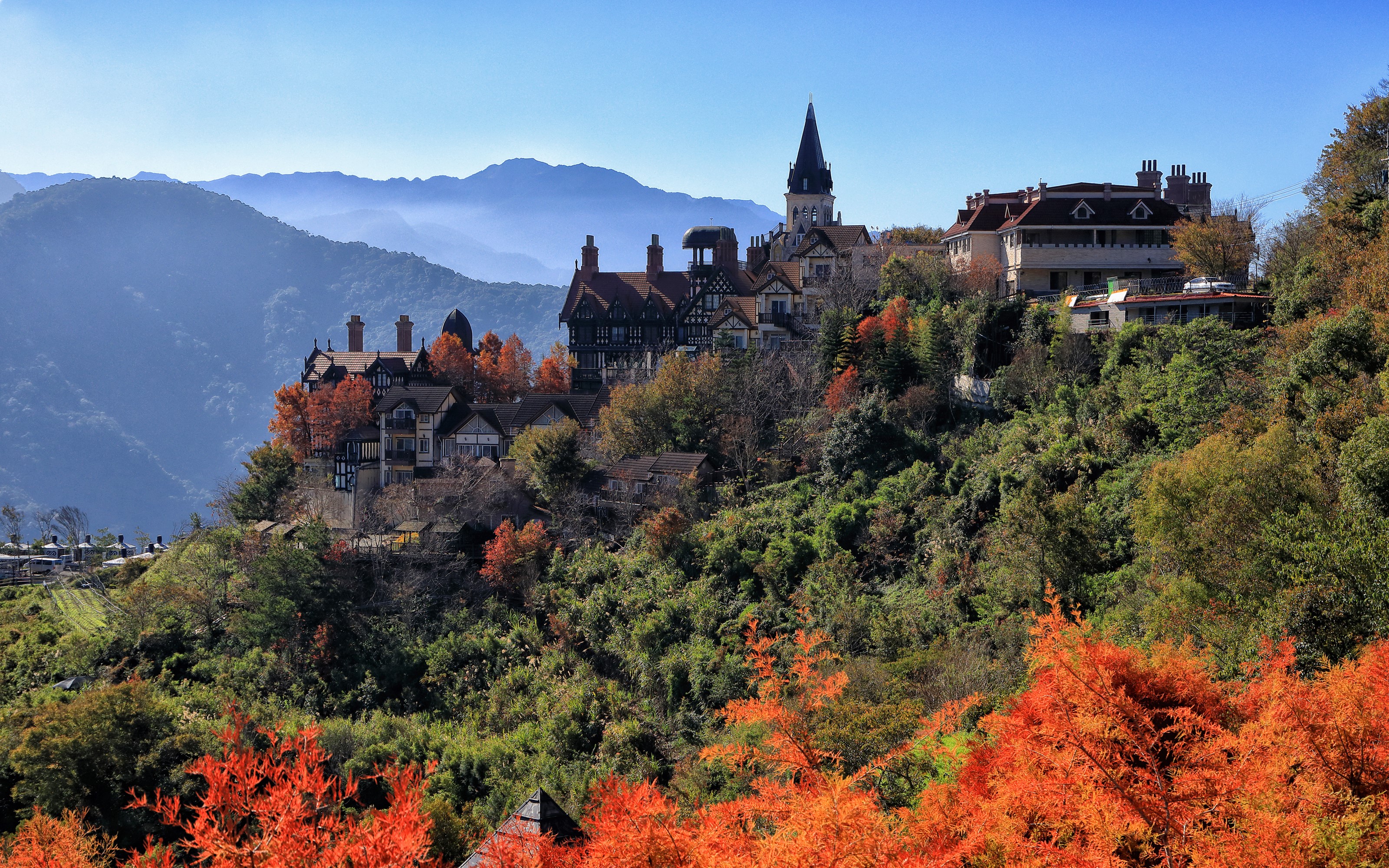 European-style houses on a mountainside in Taiwan during autumn HD Wallpaper