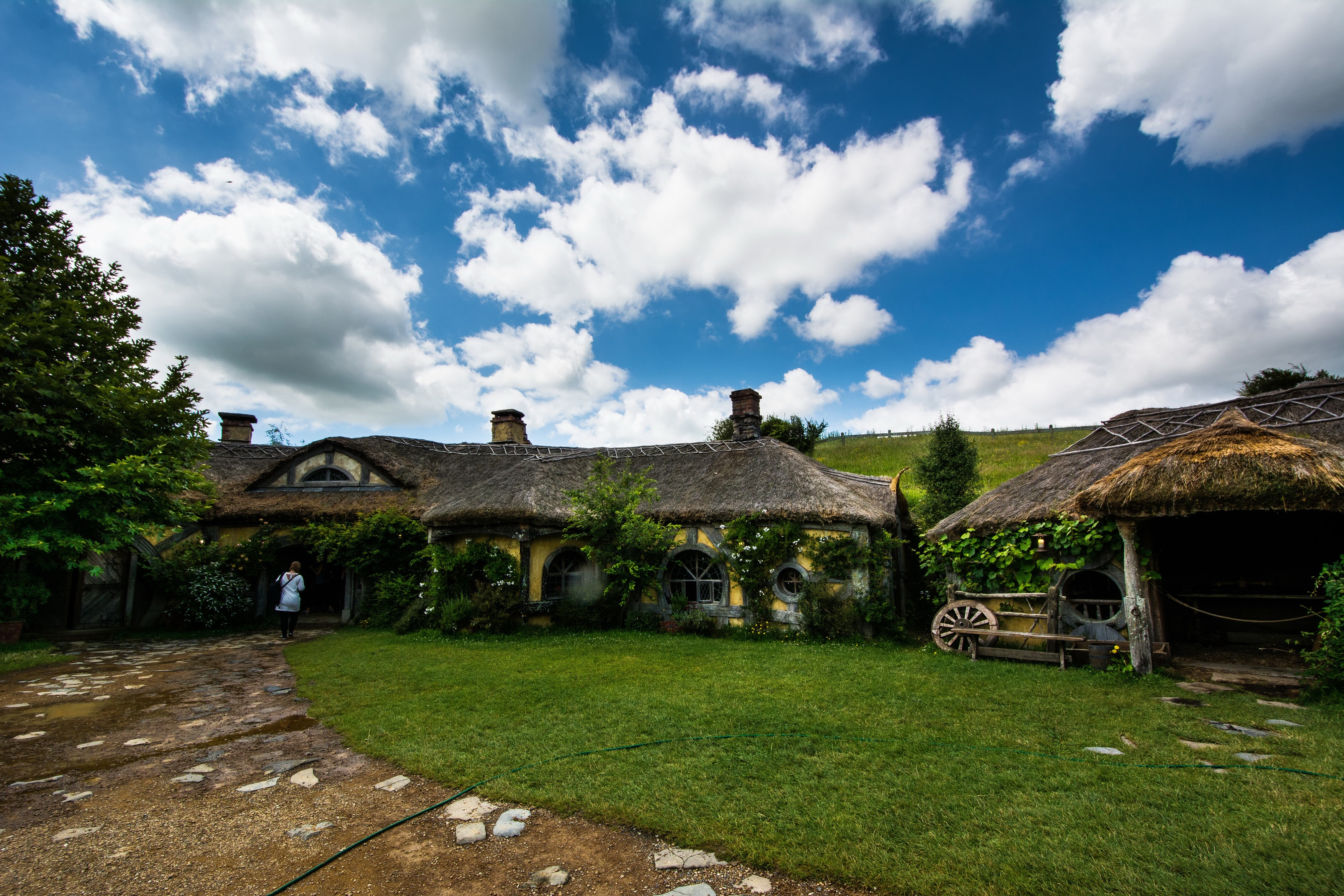 Hobbiton Houses in New Zealand under Clouds HD Wallpaper