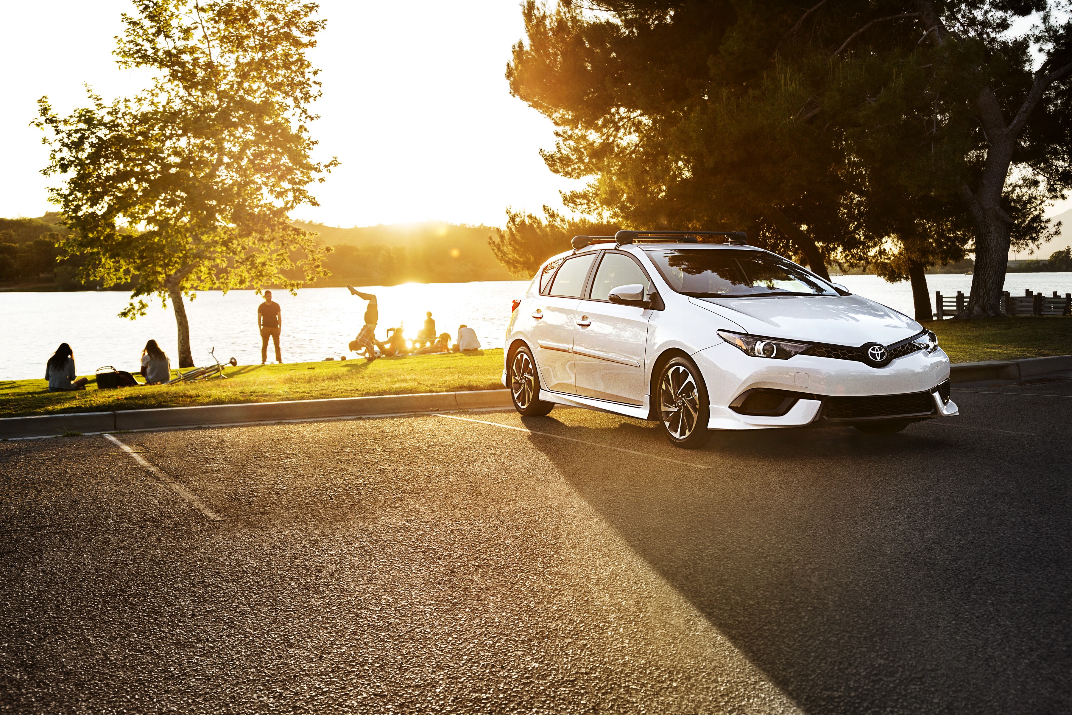 White 2017 Toyota Corolla iM parked by a lake at sunset HD Wallpaper