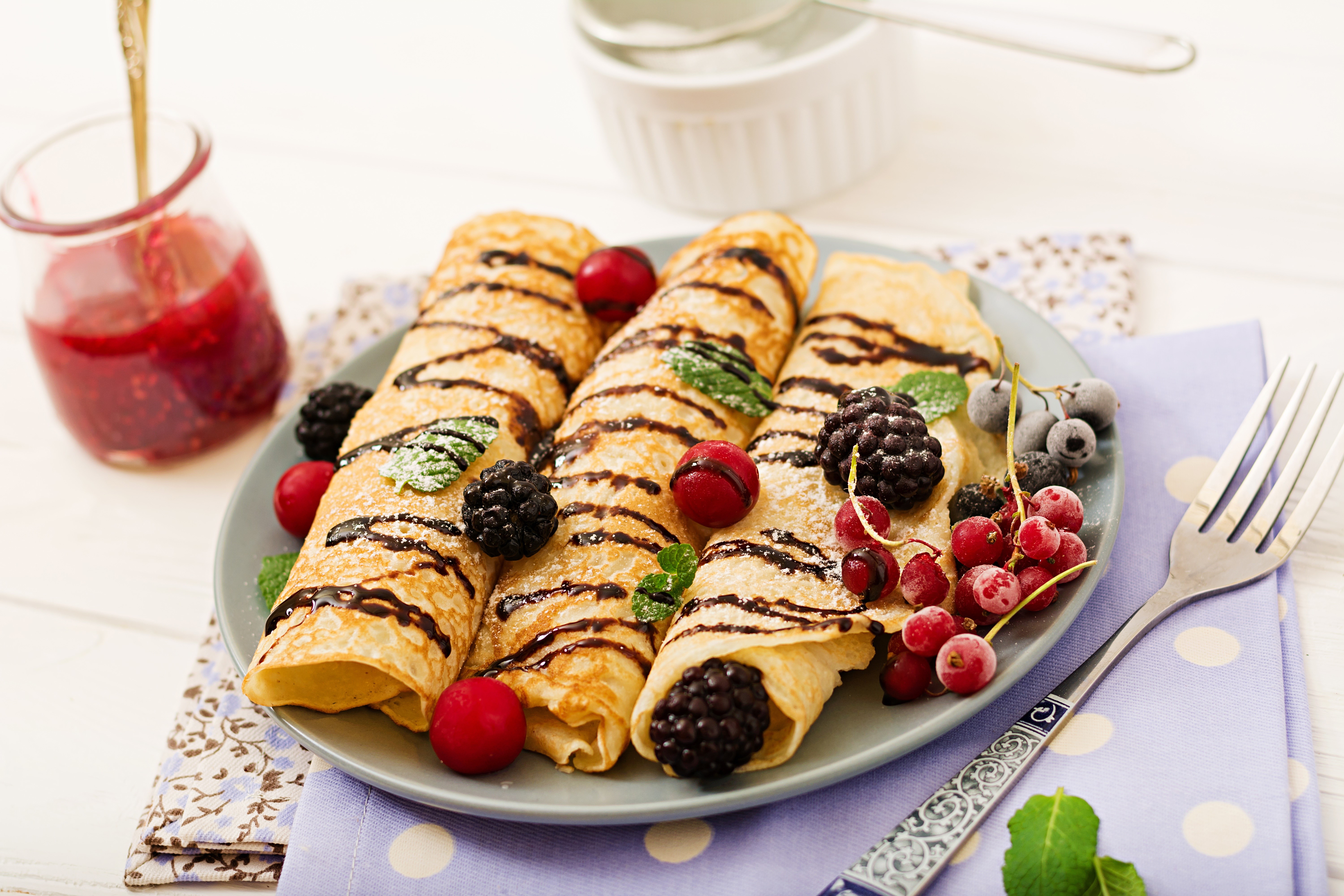 Pancakes with berries and chocolate drizzle HD Wallpaper