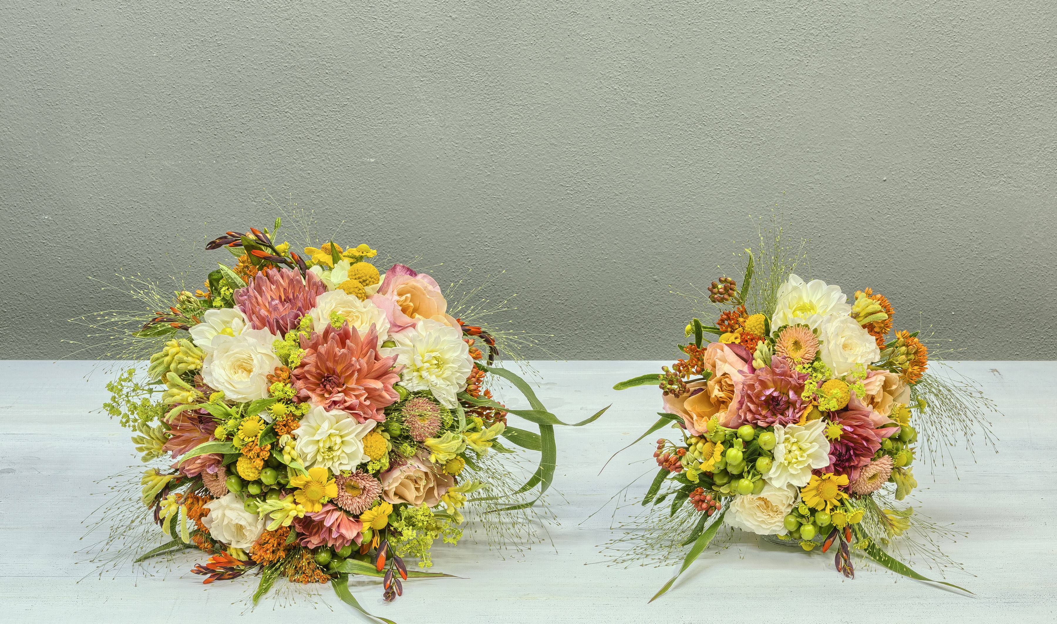 Two bouquets of flowers on a table HD Wallpaper