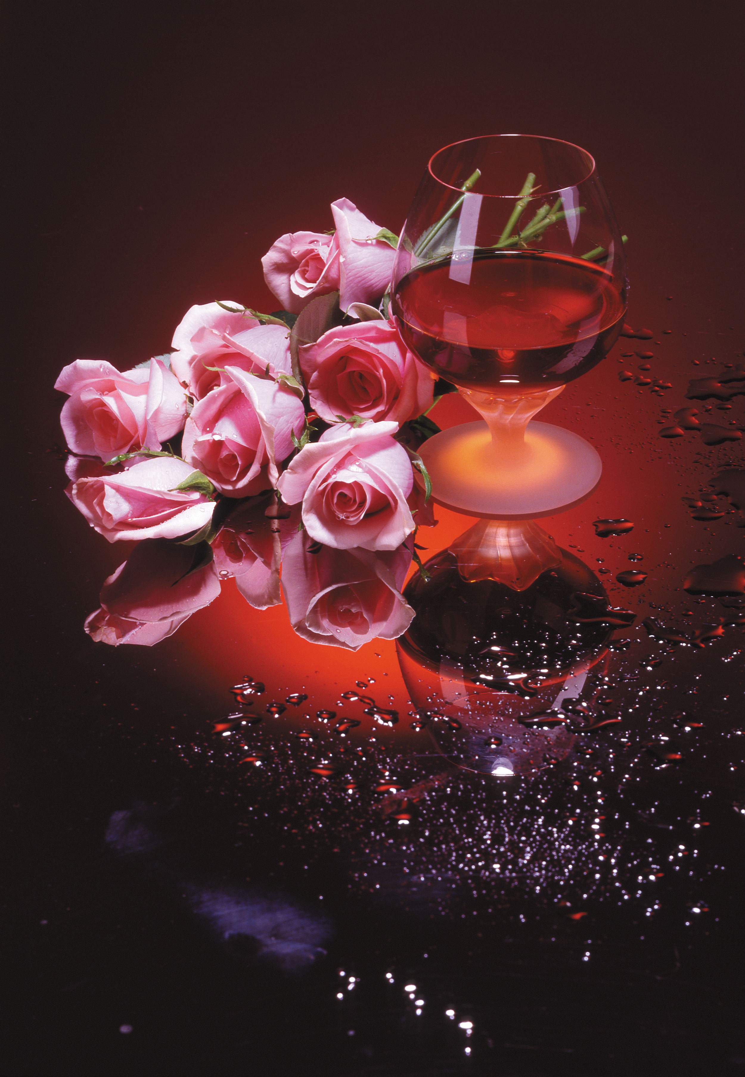 Pink roses and a glass of red wine on a reflective surface HD Phone Wallpaper