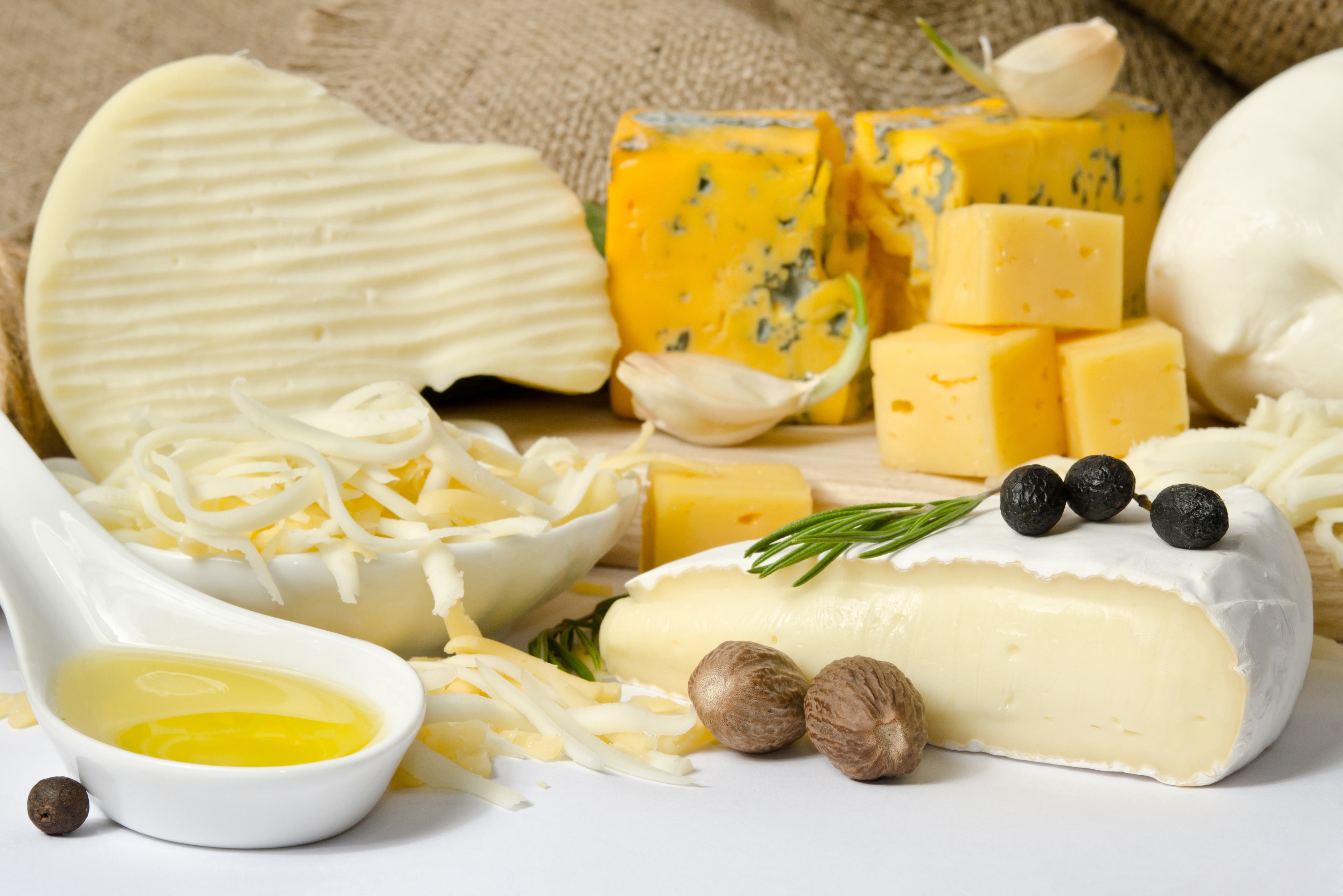 Assortment of Cheeses with Olive and Garlic HD Wallpaper