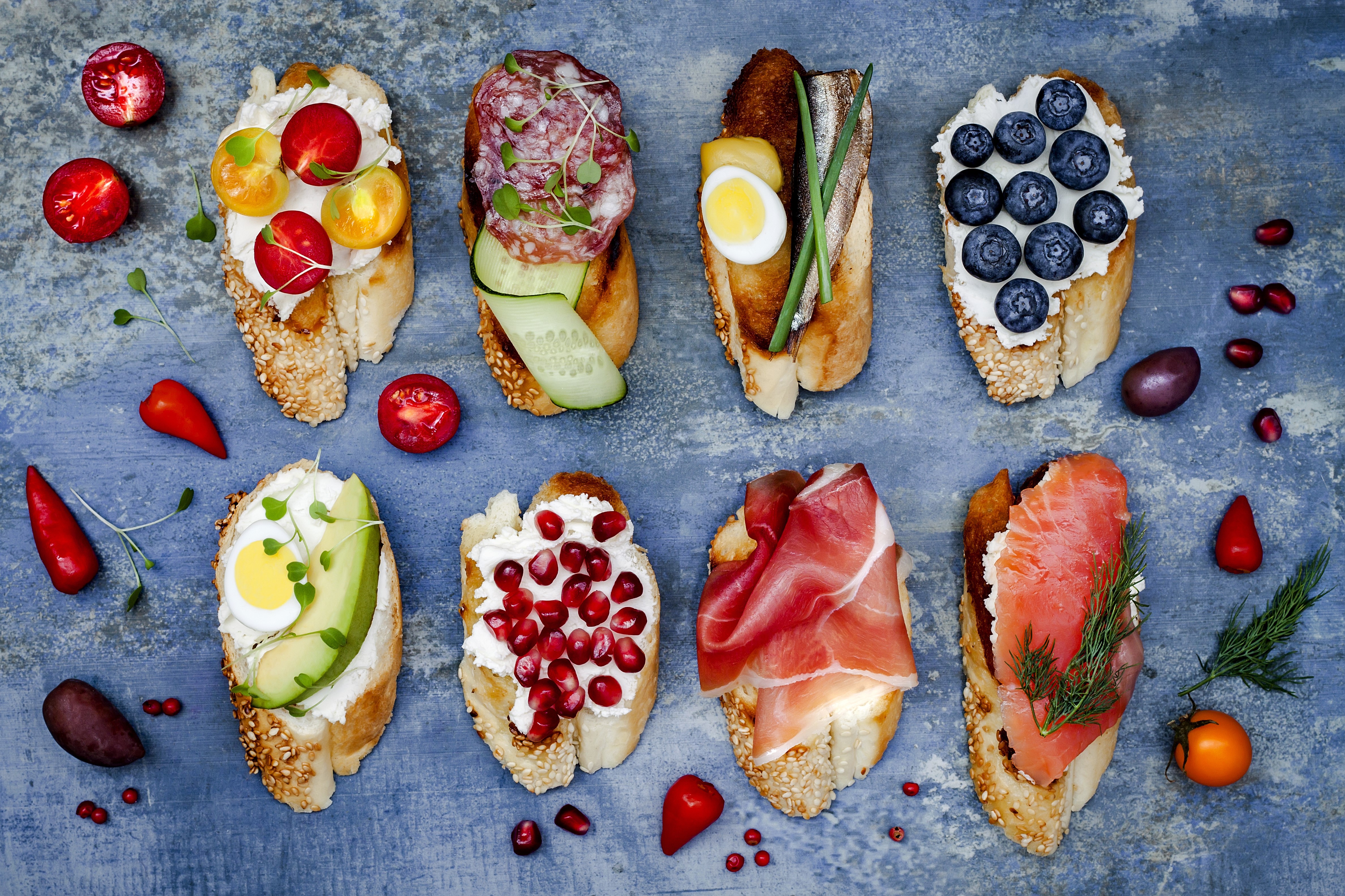 Assortment of Bruschetta with Various Toppings HD Wallpaper
