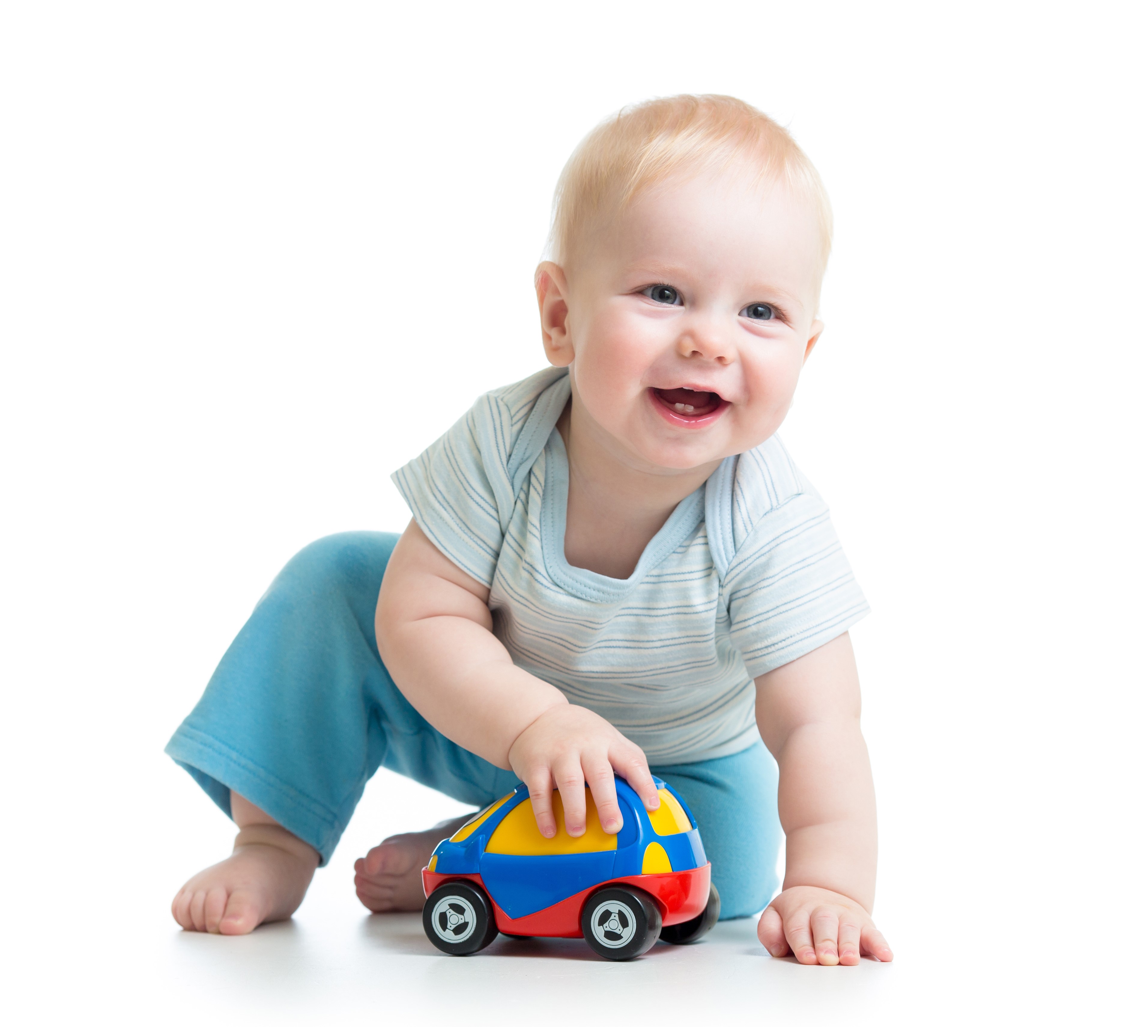 Baby playing with a toy car on a white background HD Wallpaper