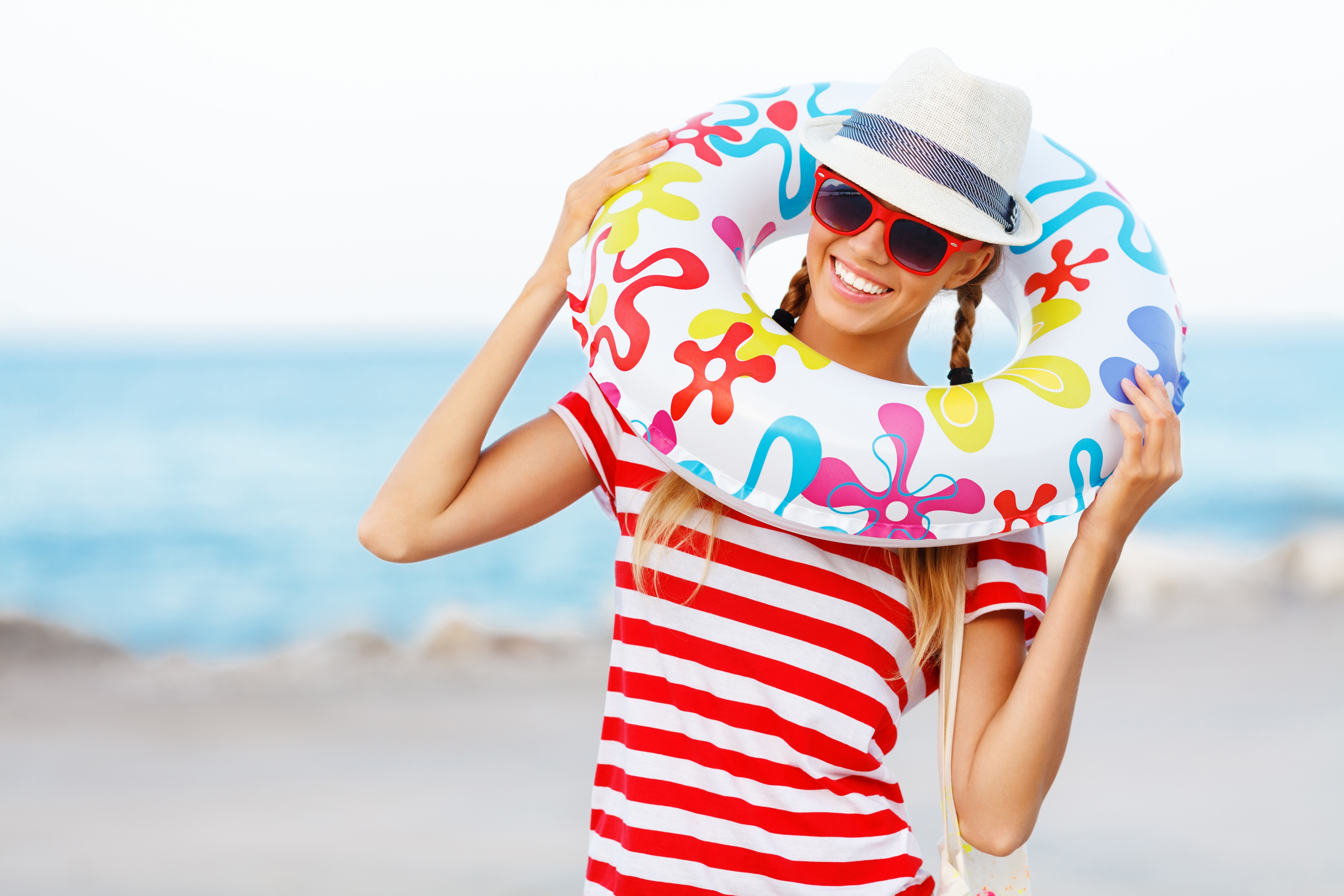 Woman with inflatable ring at the beach HD Wallpaper