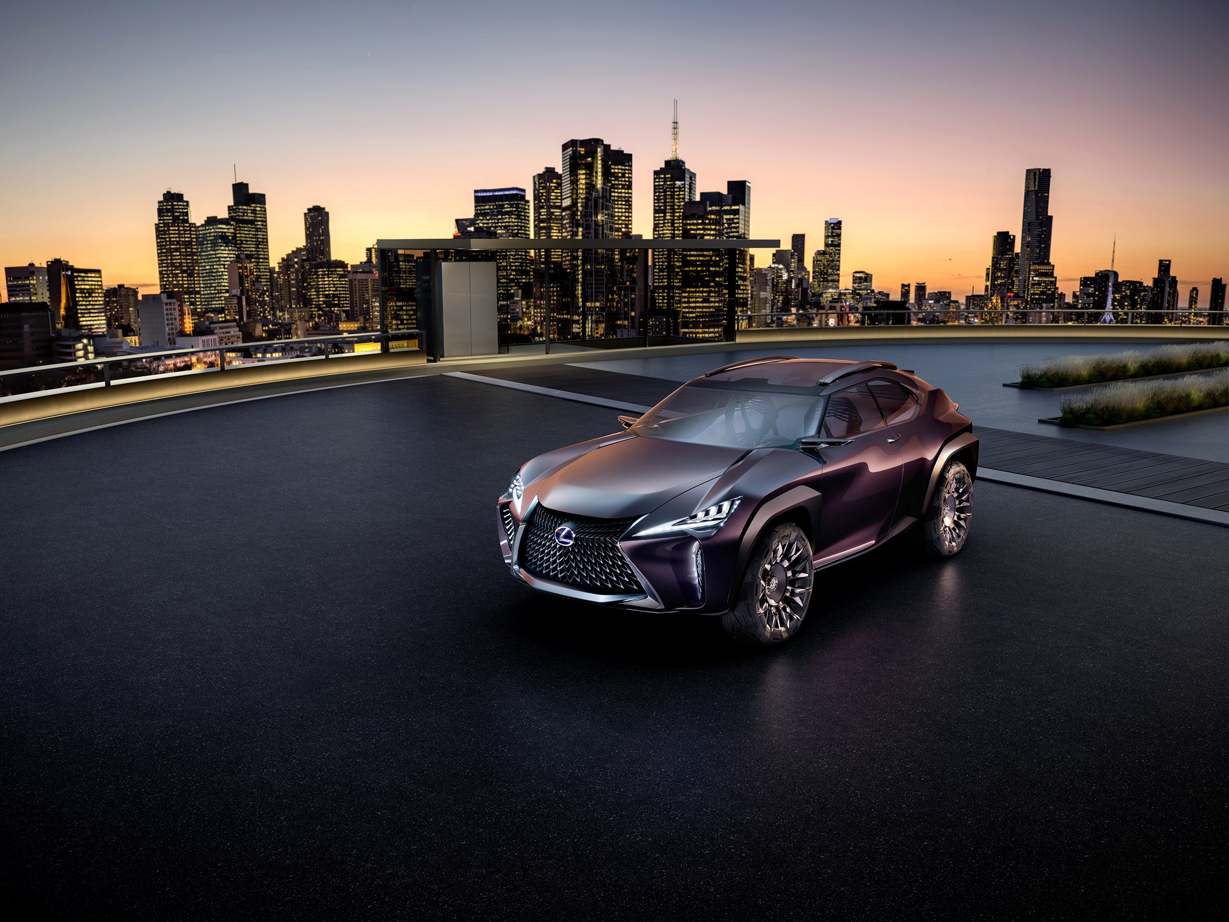 Lexus UX Concept car on a rooftop with city skyline HD Wallpaper