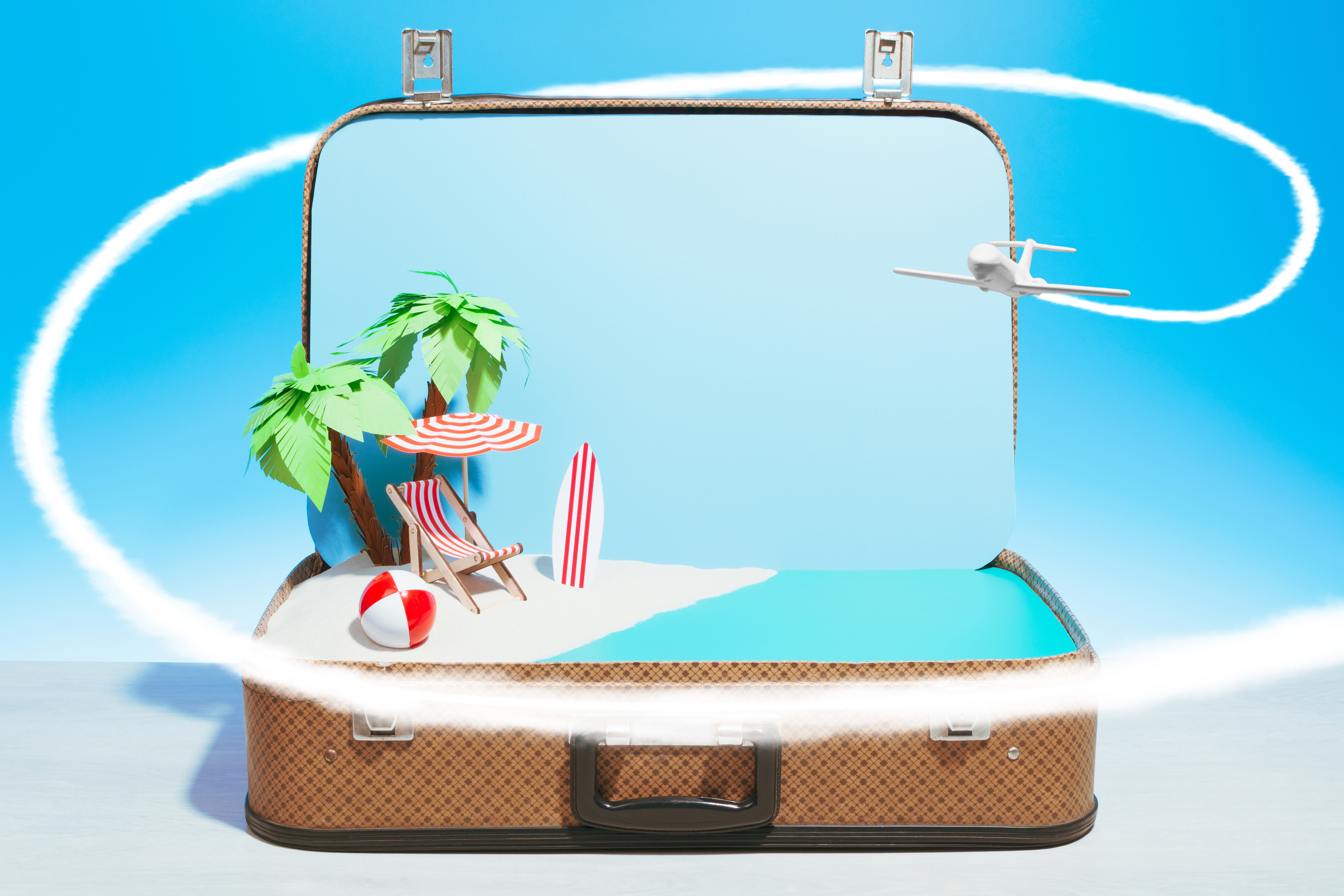 Suitcase with beach scene and airplane HD Wallpaper