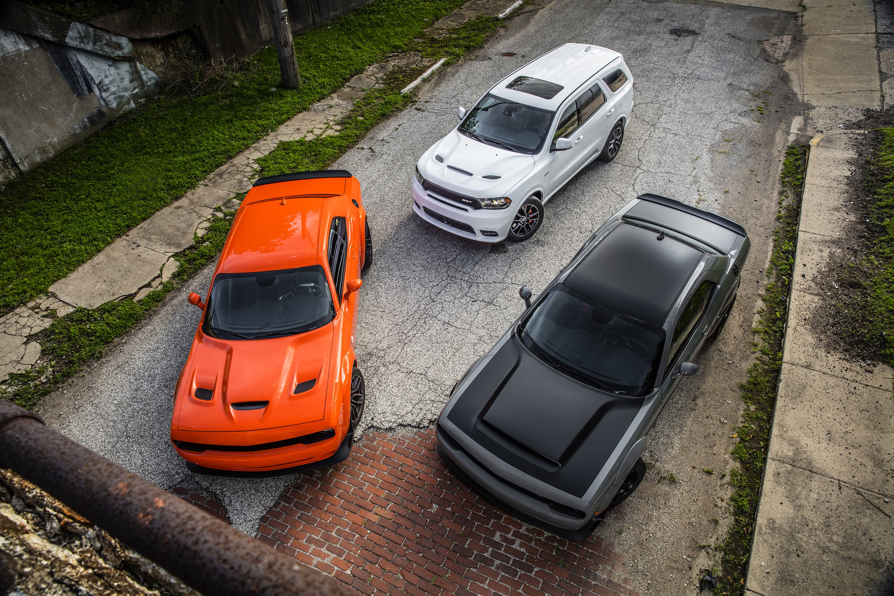Three Dodge cars from above HD Wallpaper