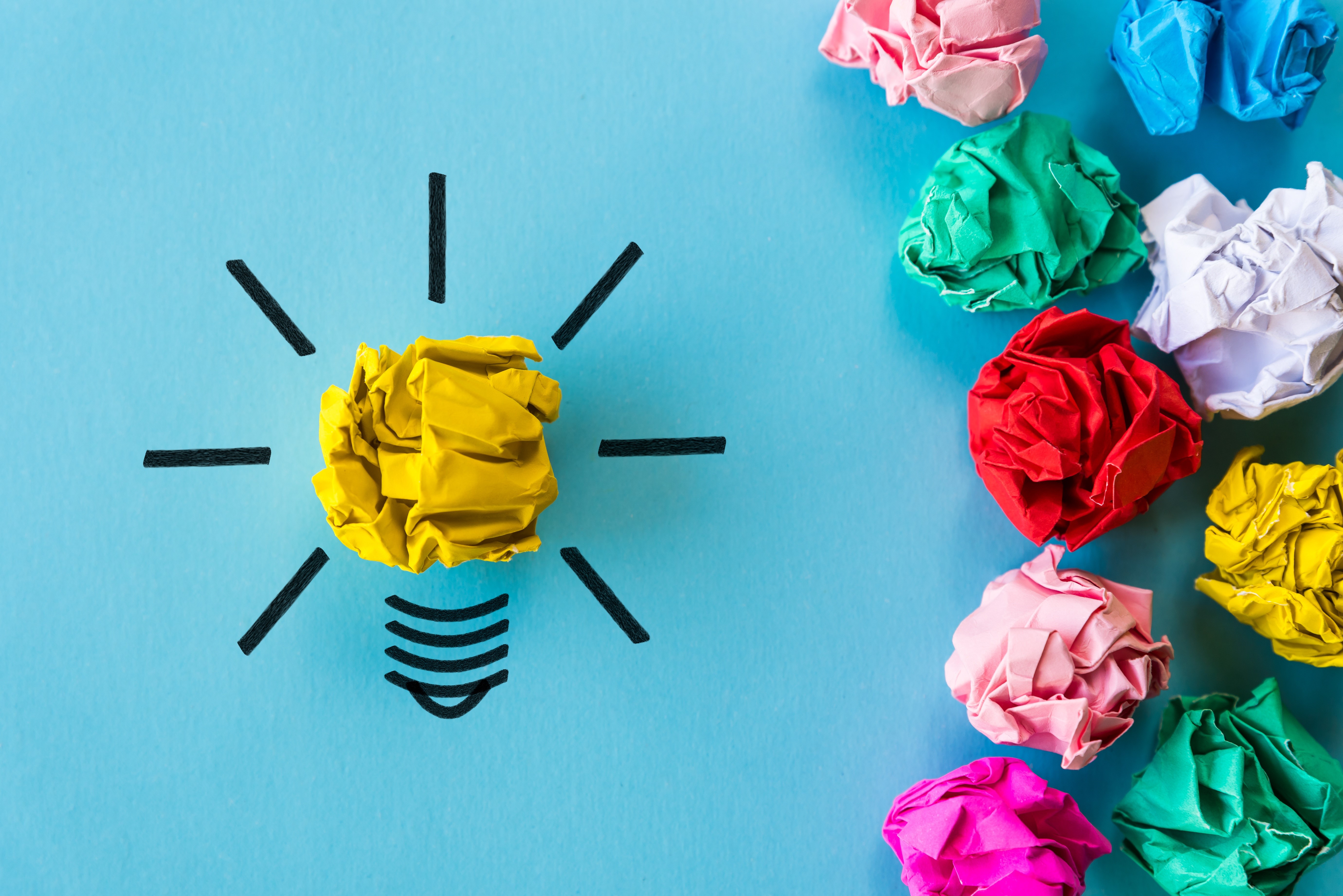 Light bulb idea with crumpled paper balls HD Wallpaper