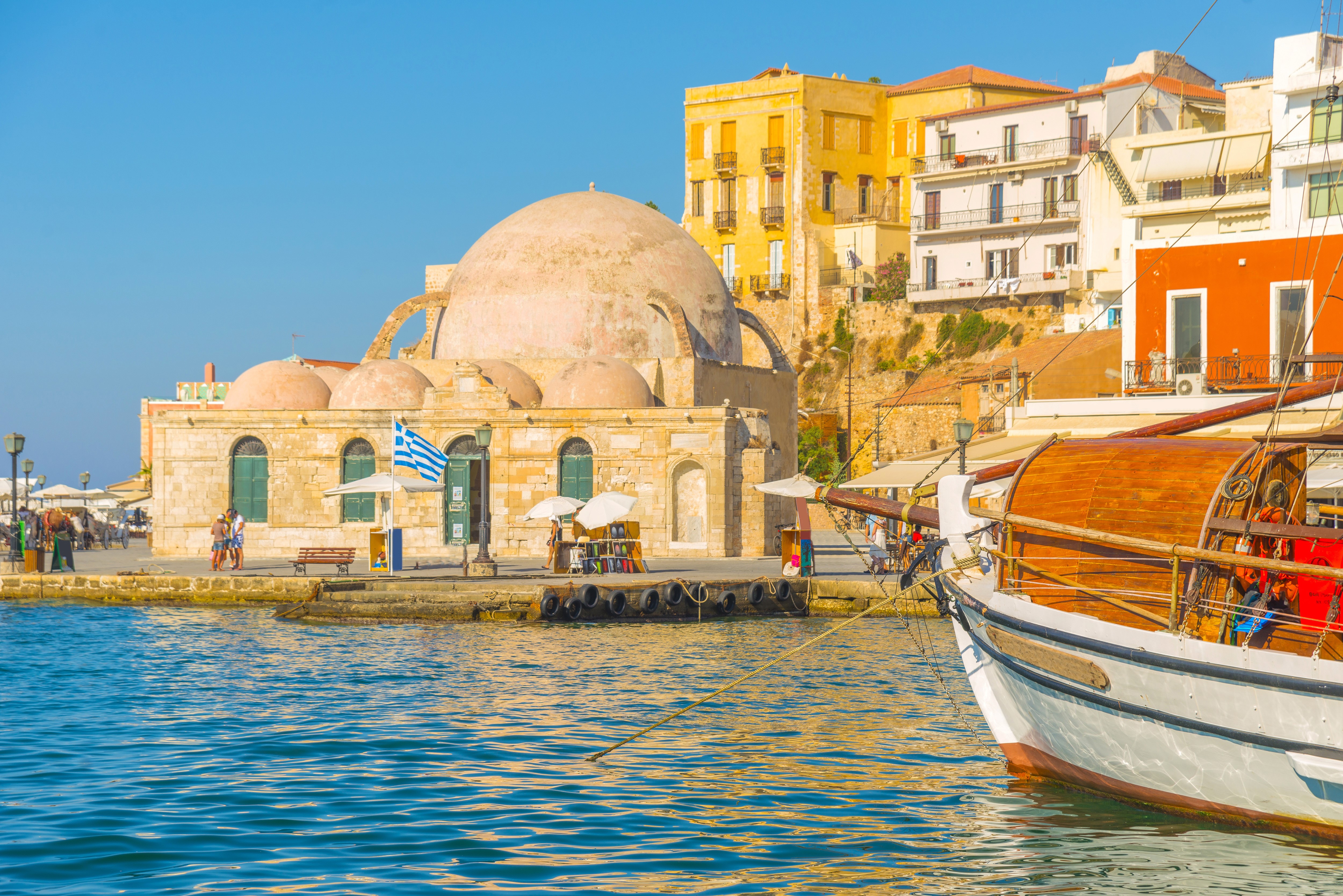 Chania port Crete Greece with boat and buildings HD Wallpaper