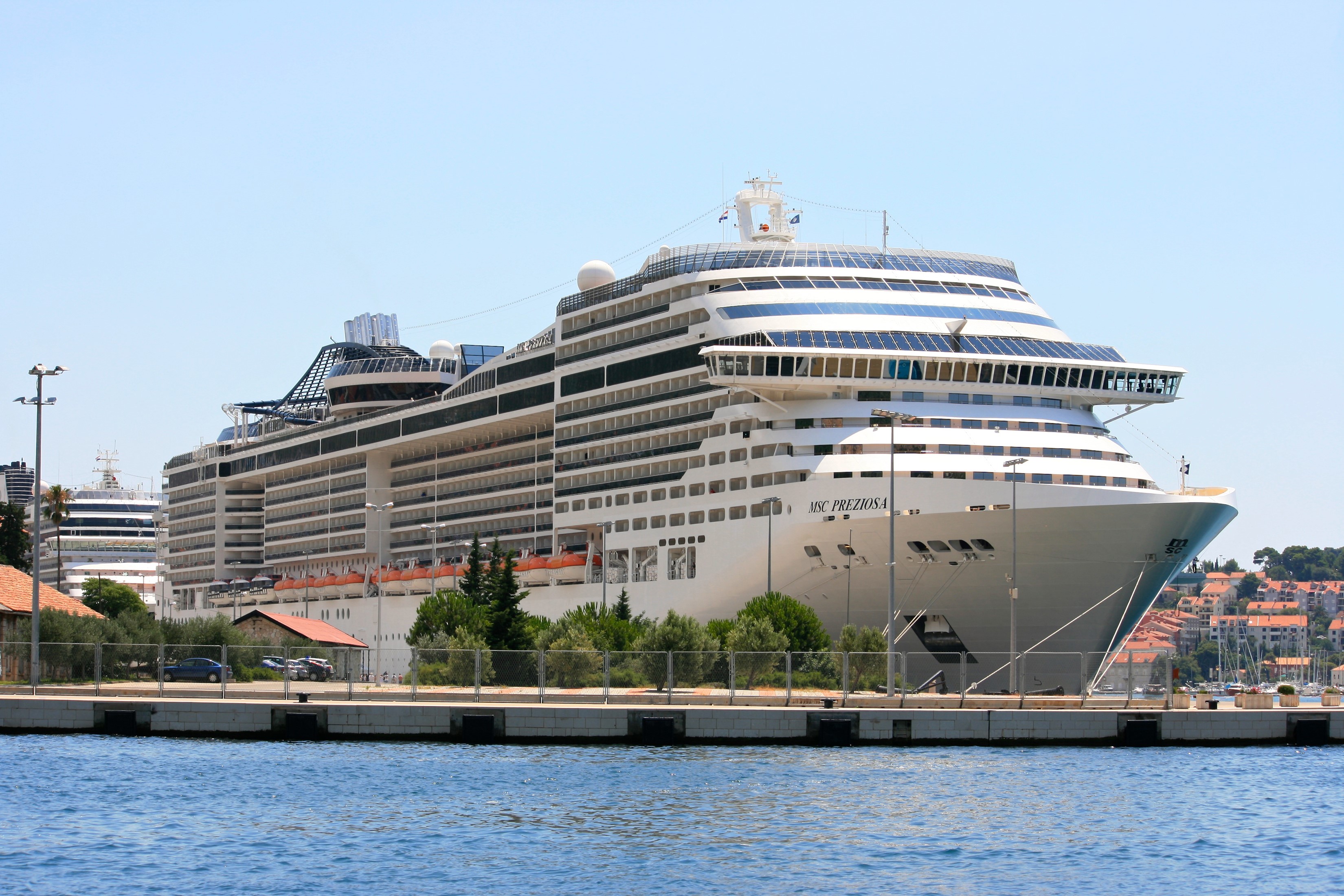 MSC Preziosa cruise liner docked at a marina HD Wallpaper