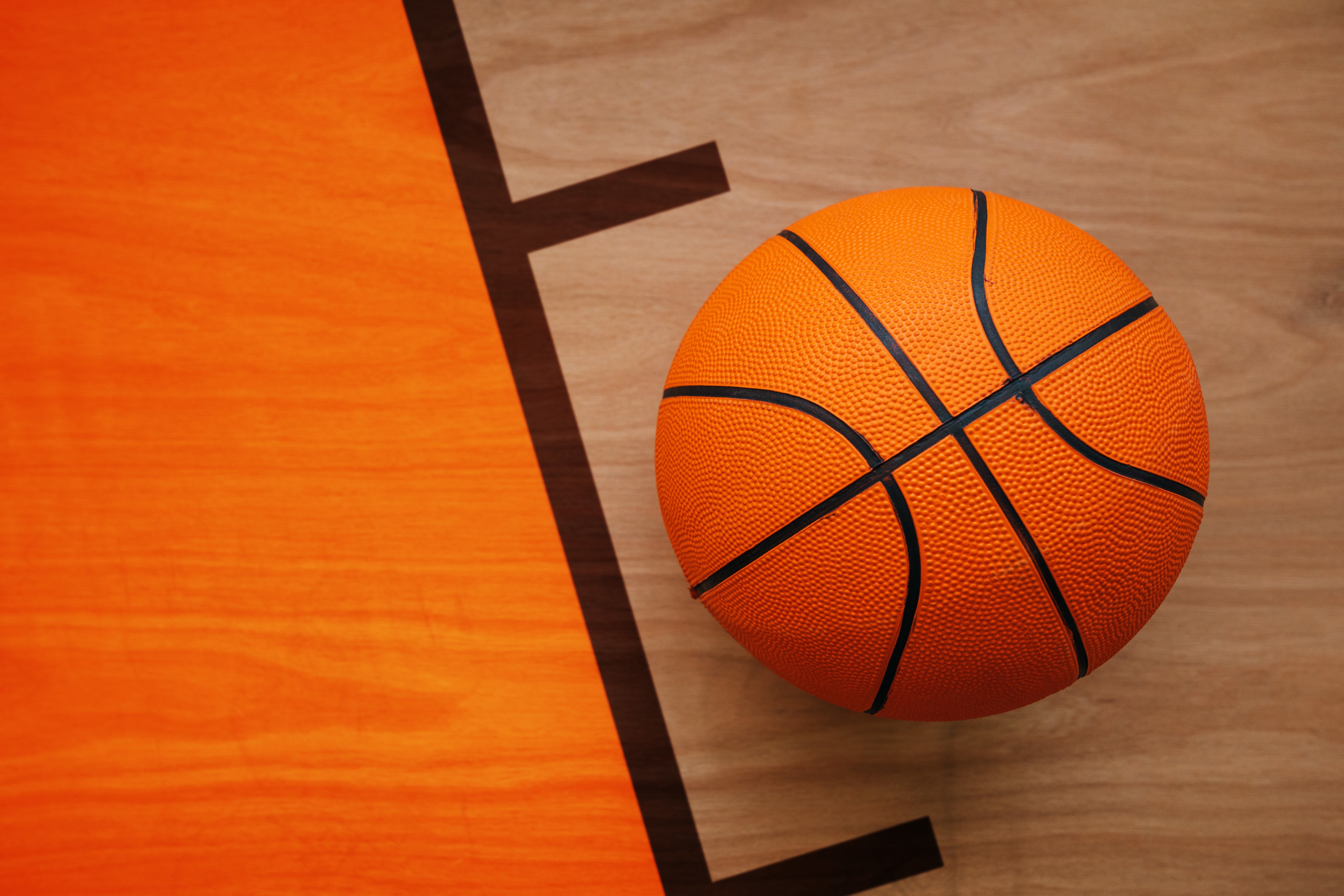 Basketball on a wooden court HD Wallpaper