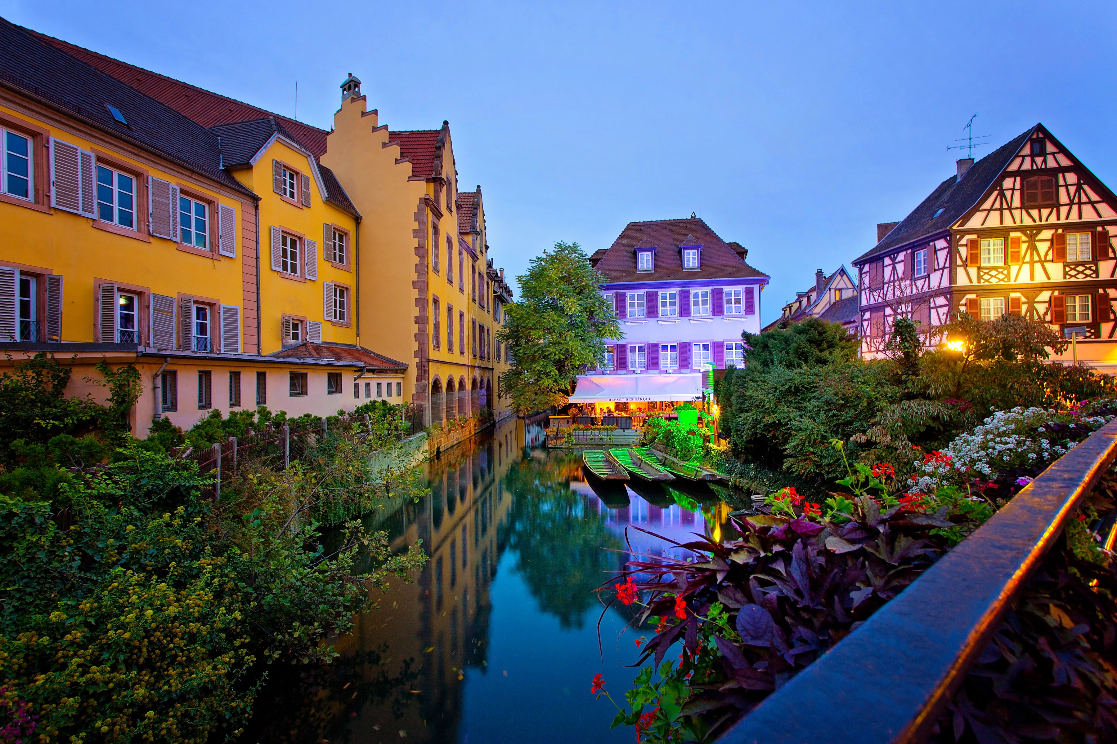 Colmar, France canal with colorful houses and boats at dusk HD Wallpaper