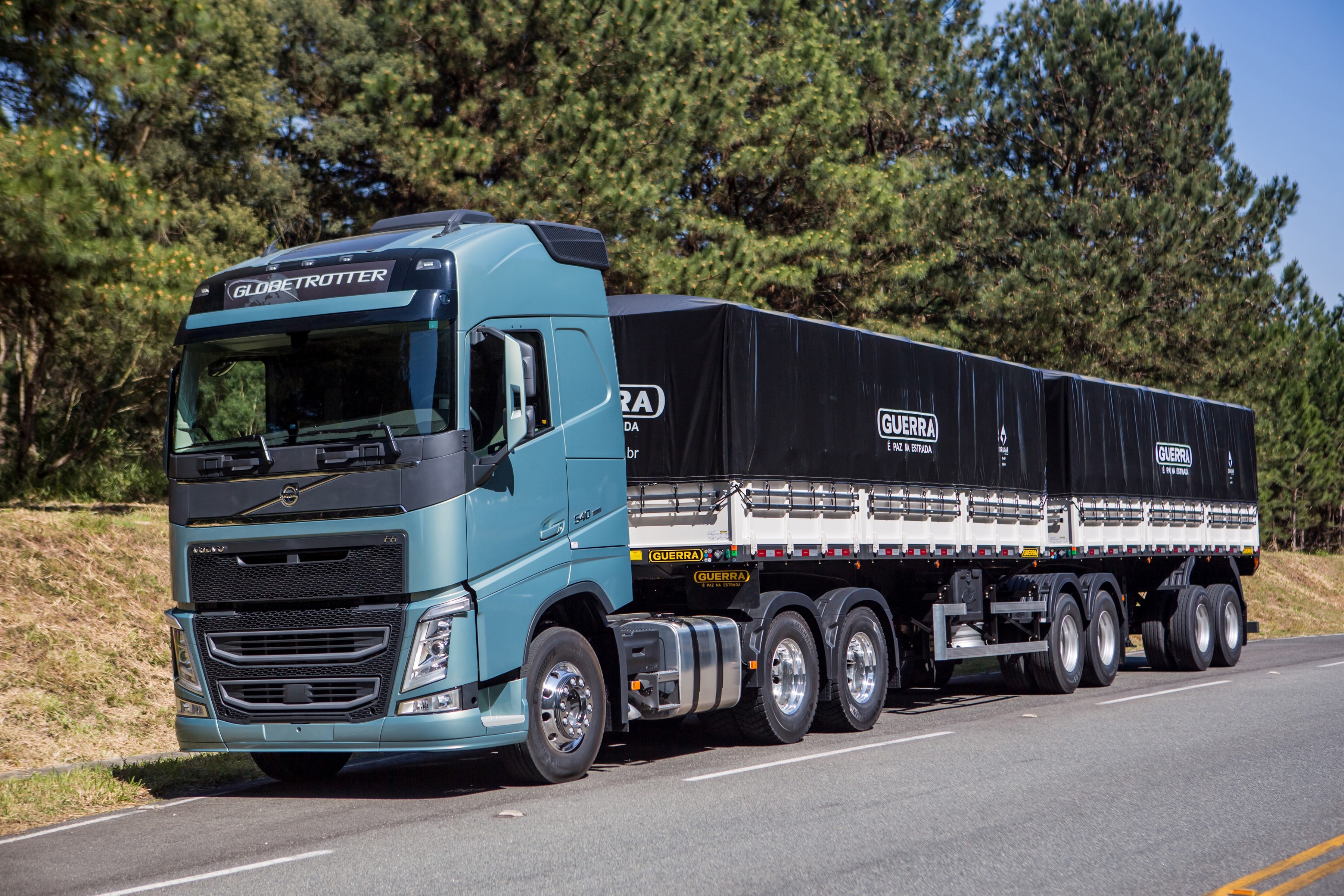 Blue Volvo Globetrotter Truck with Guerra Trailers HD Wallpaper
