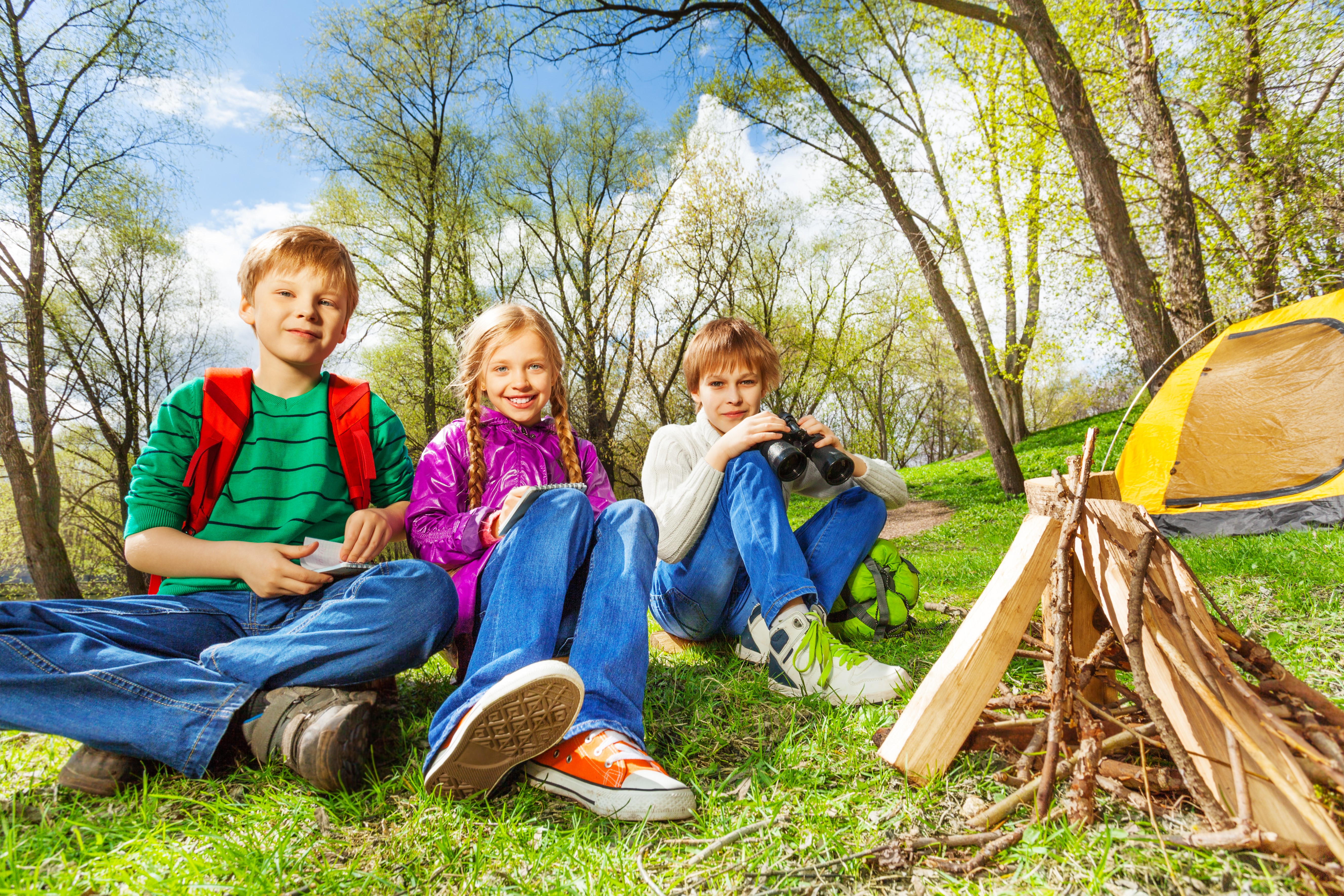 Three children camping with bonfire and tent HD Wallpaper