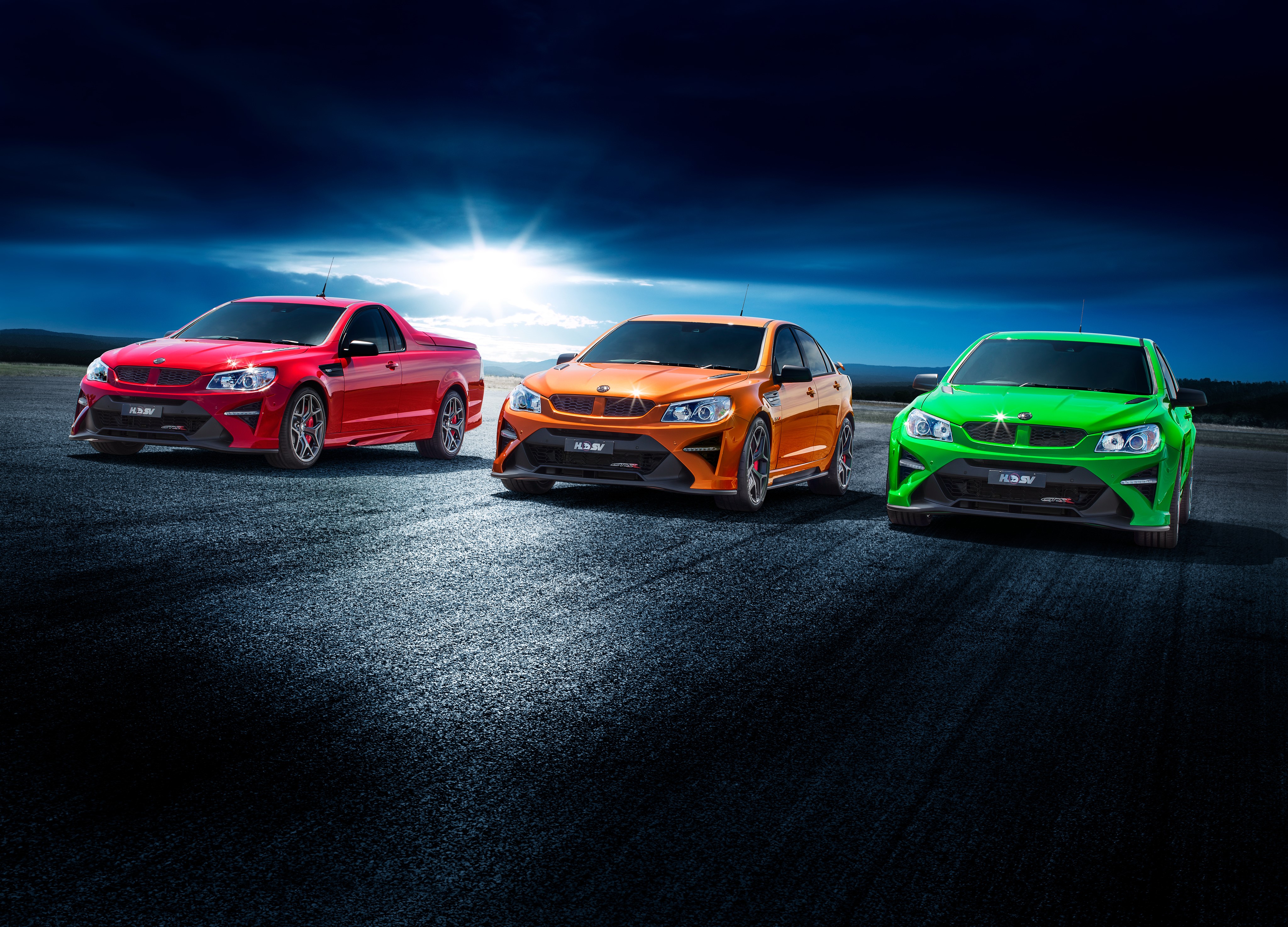 Three HSV Holden Cars on a Racetrack HD Wallpaper