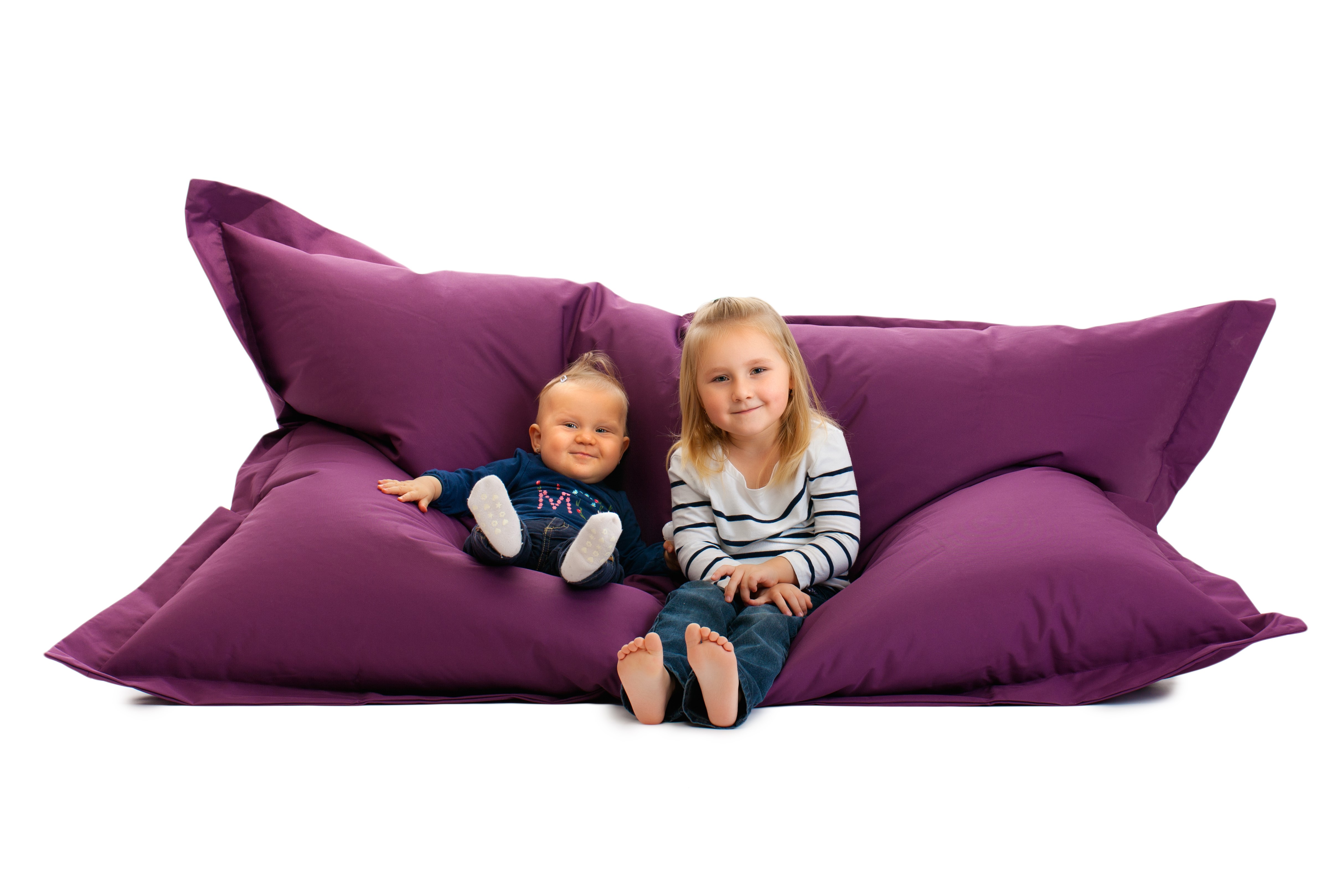 Two children on a purple beanbag sofa HD Wallpaper