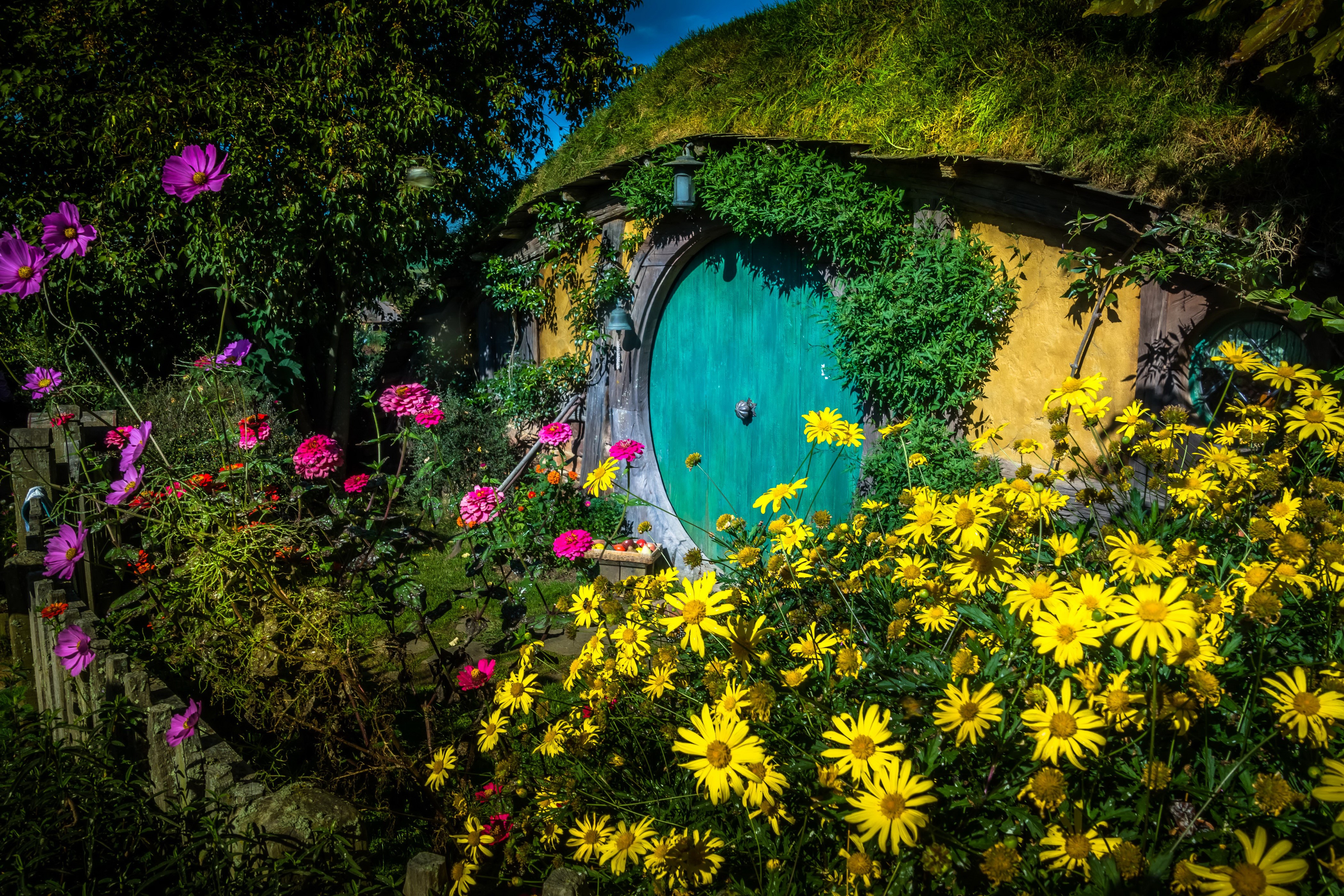 Hobbit House in Matamata, New Zealand with Flowers HD Wallpaper