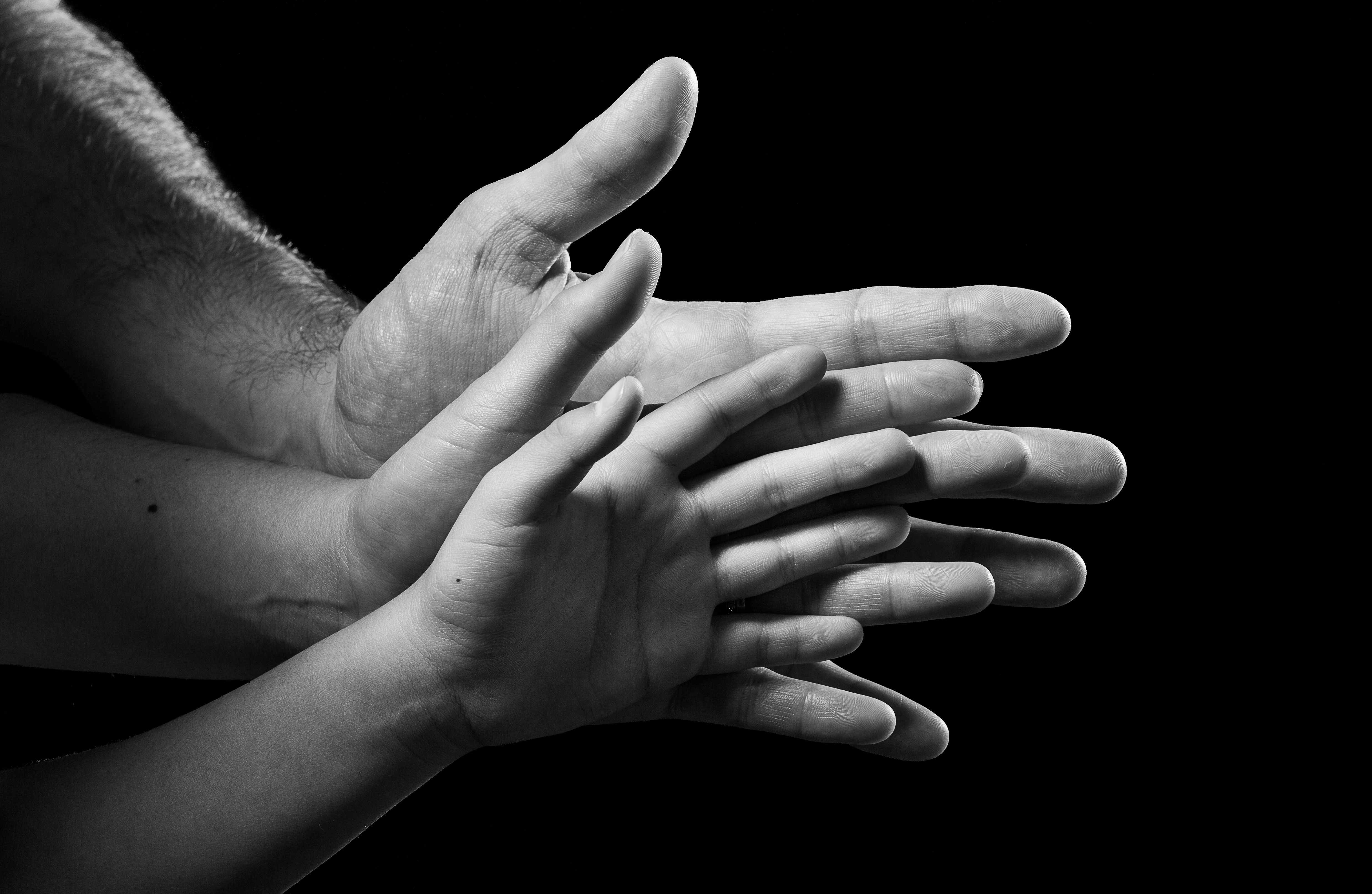 Multiple hands stacked together, close-up HD Wallpaper