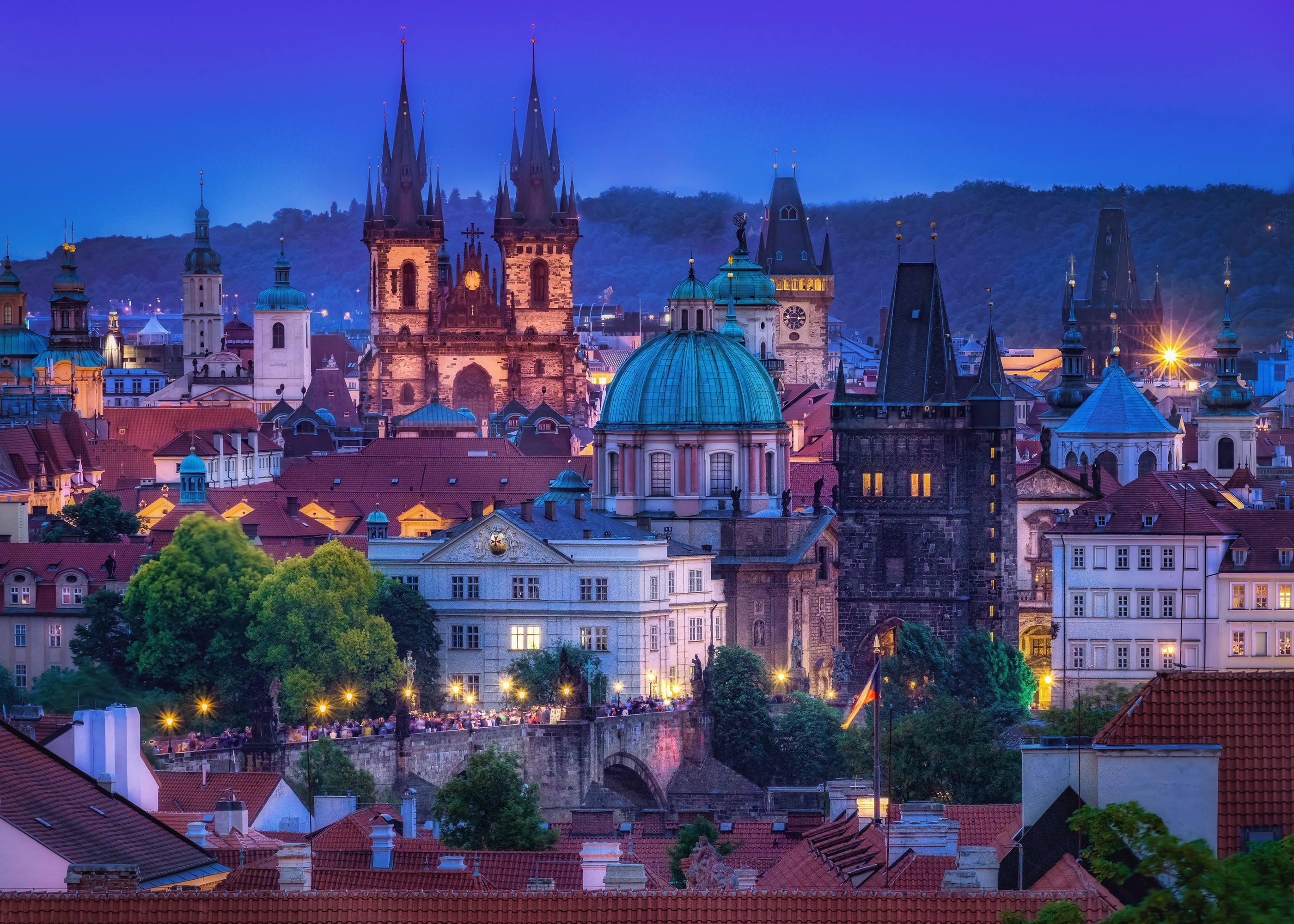 Prague cityscape with historic buildings at dusk HD Wallpaper