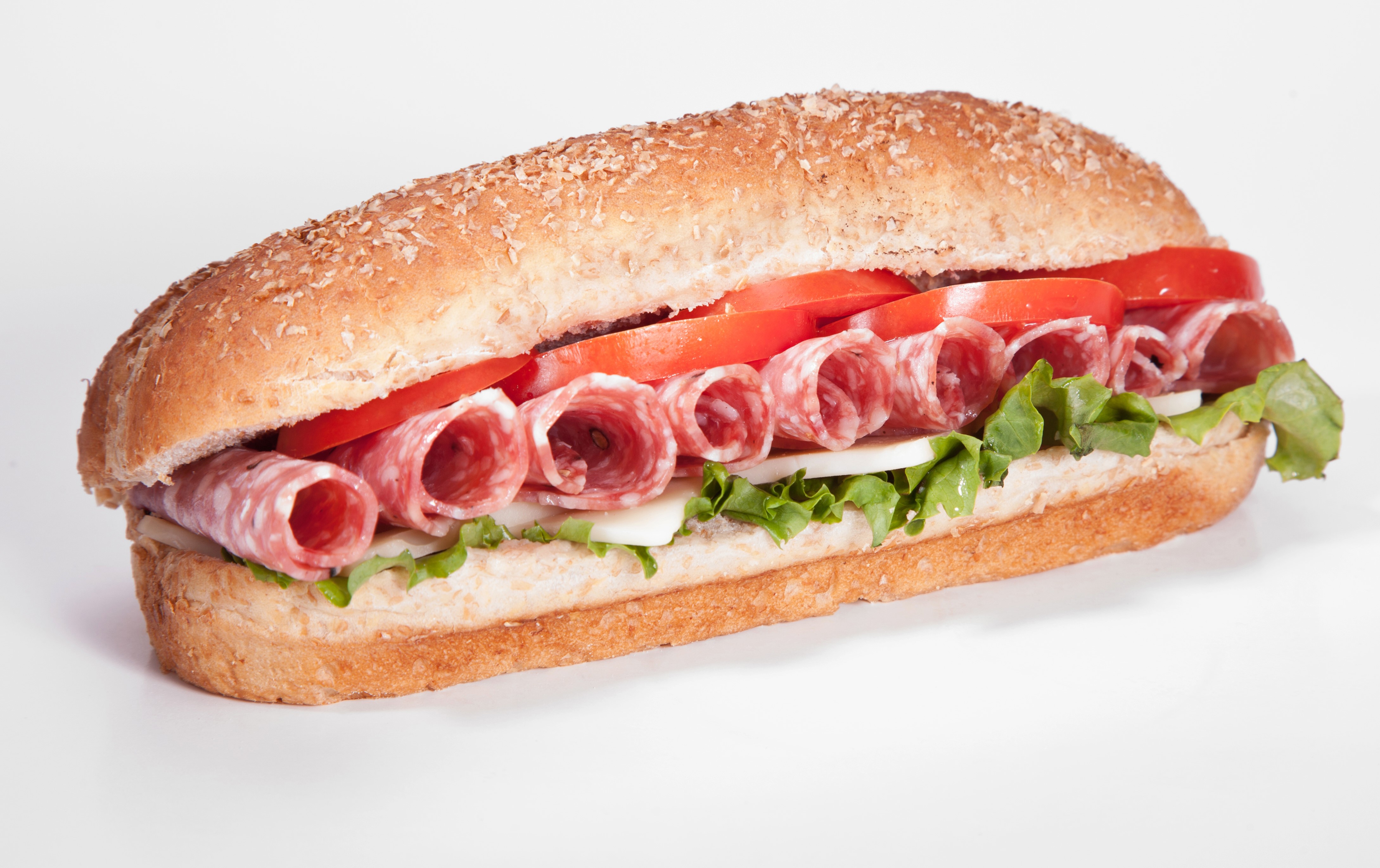 Sandwich with salami, tomatoes, lettuce, and cheese on a bun HD Wallpaper