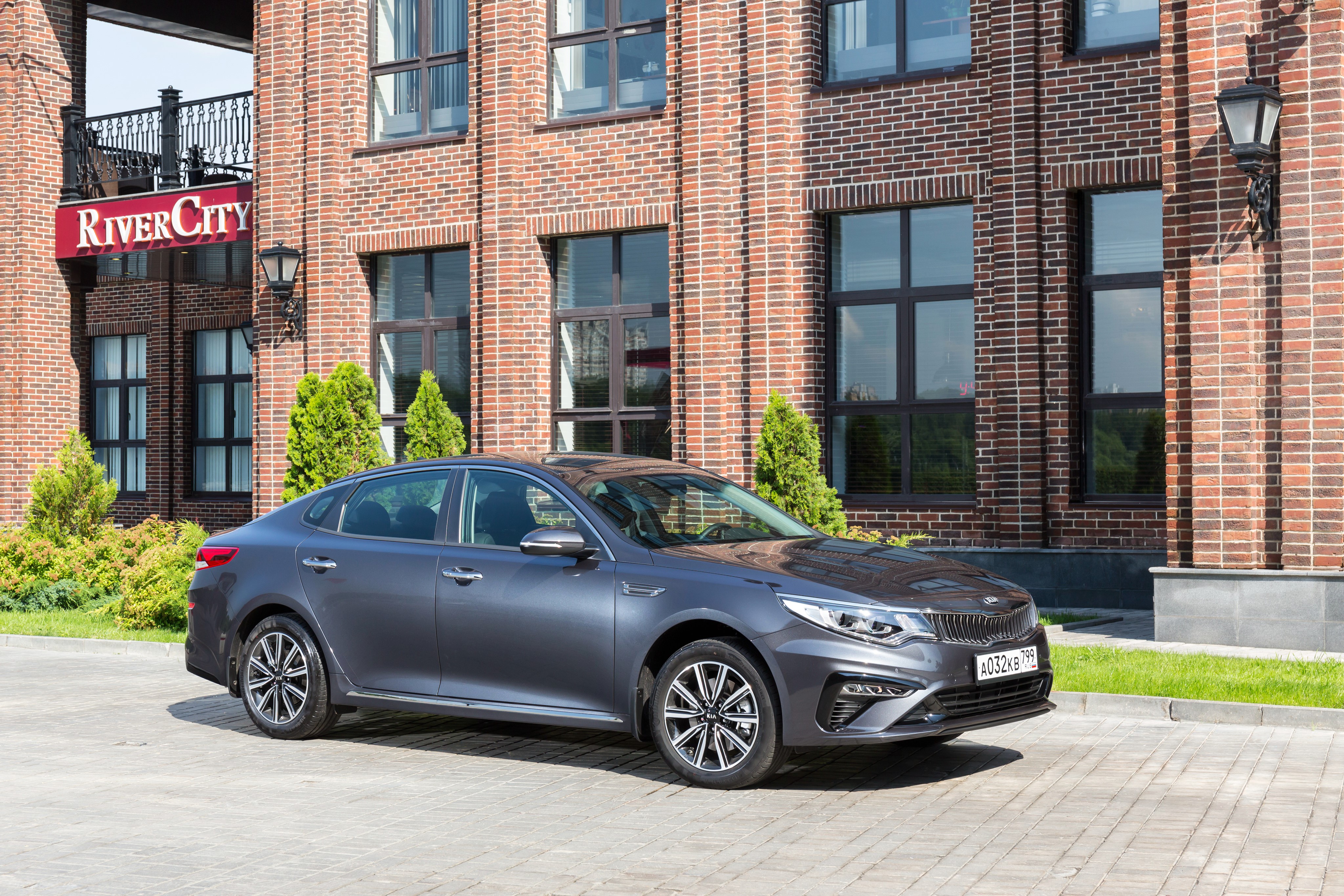 Grey Kia Optima 2018 parked near River City building HD Wallpaper