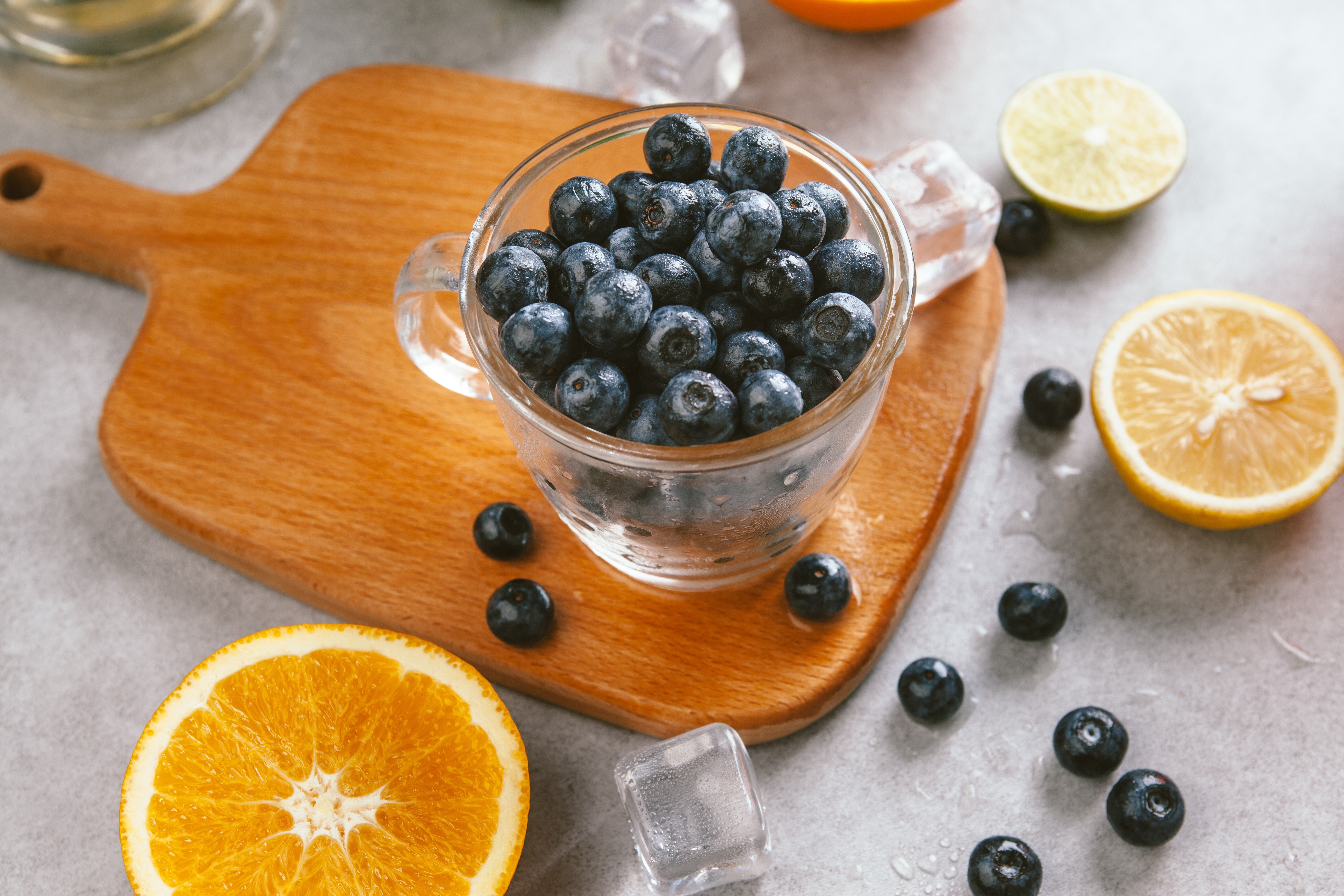 Blueberries in a glass with citrus fruits HD Wallpaper