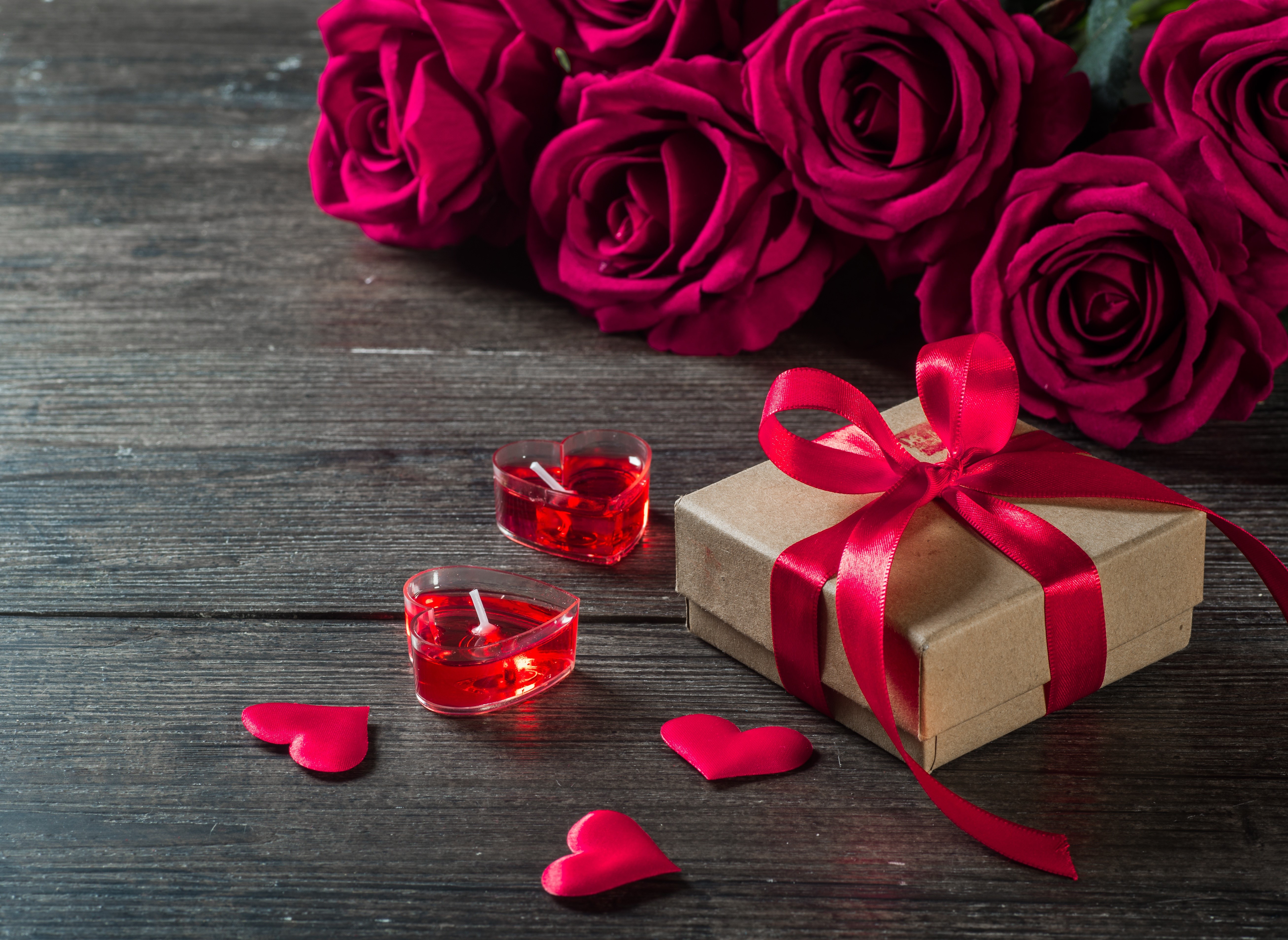 Red Roses, Gift Box, and Heart Candles on Wooden Table HD Wallpaper