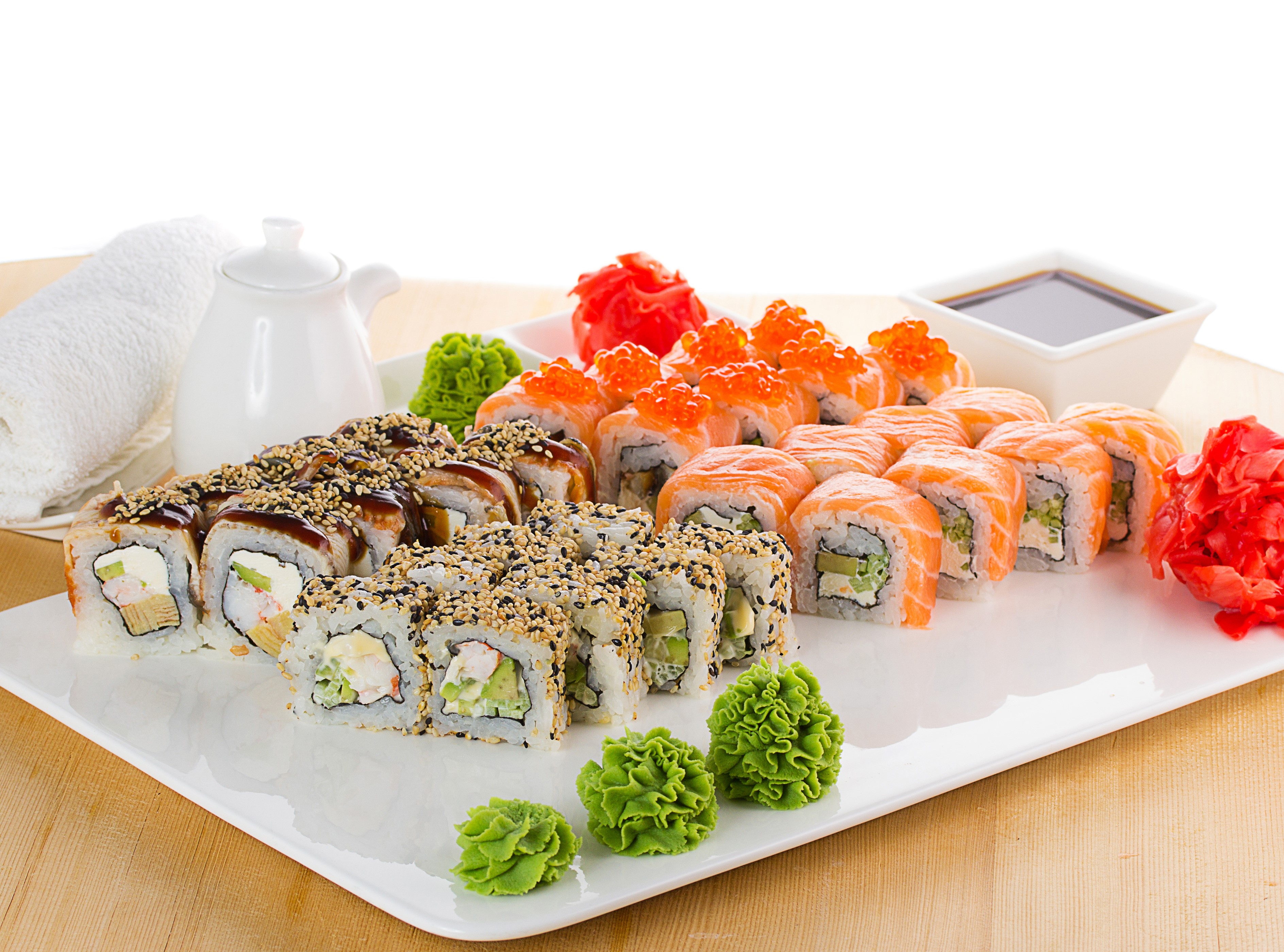 Assortment of sushi rolls with salmon, caviar, and eel HD Wallpaper