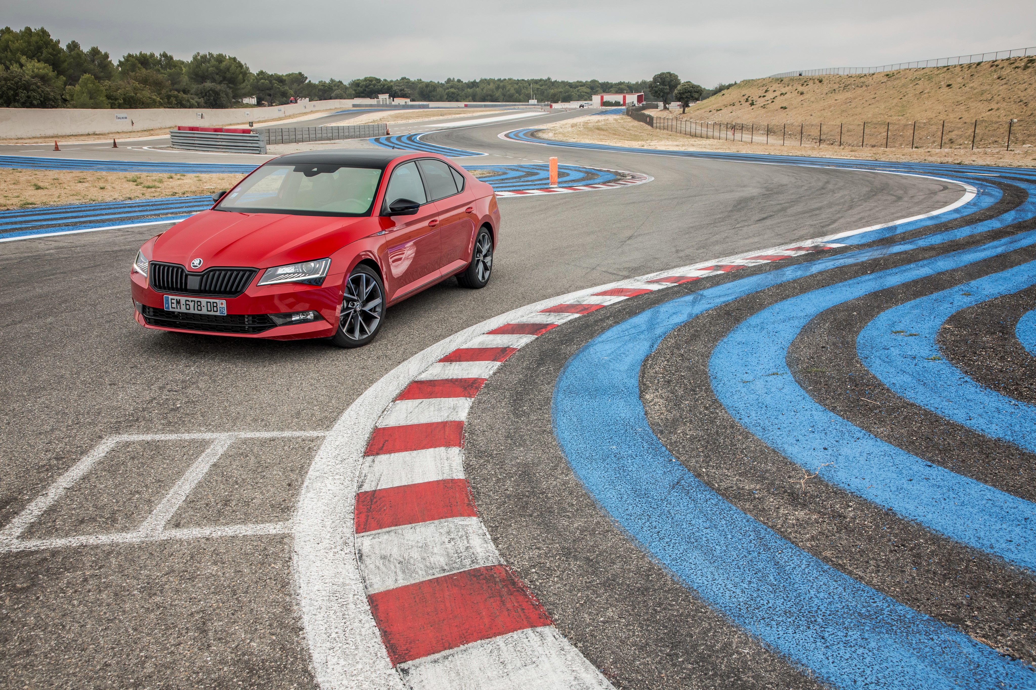 Red Skoda Superb SportLine on a Race Track HD Wallpaper