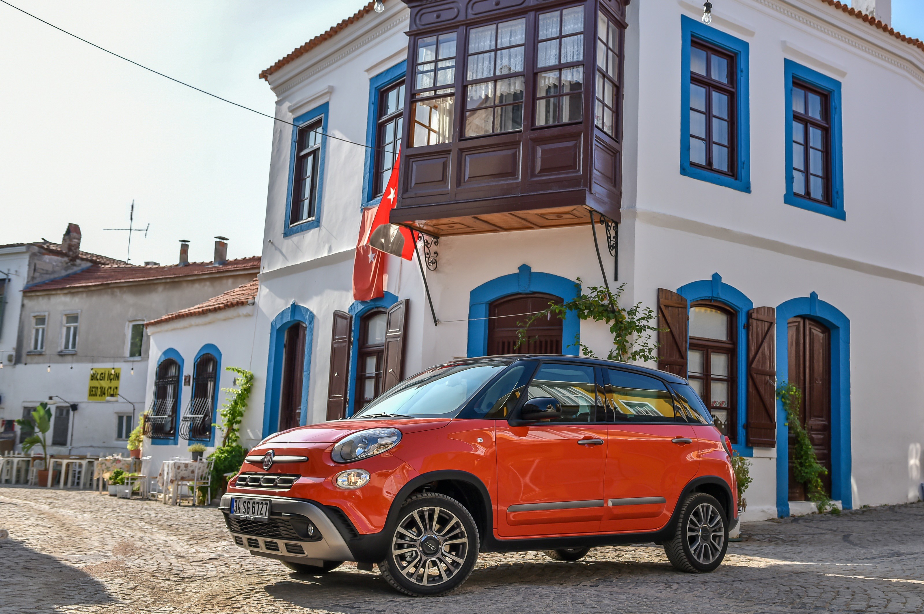 Orange Fiat 500L Cross parked in a European town HD Wallpaper