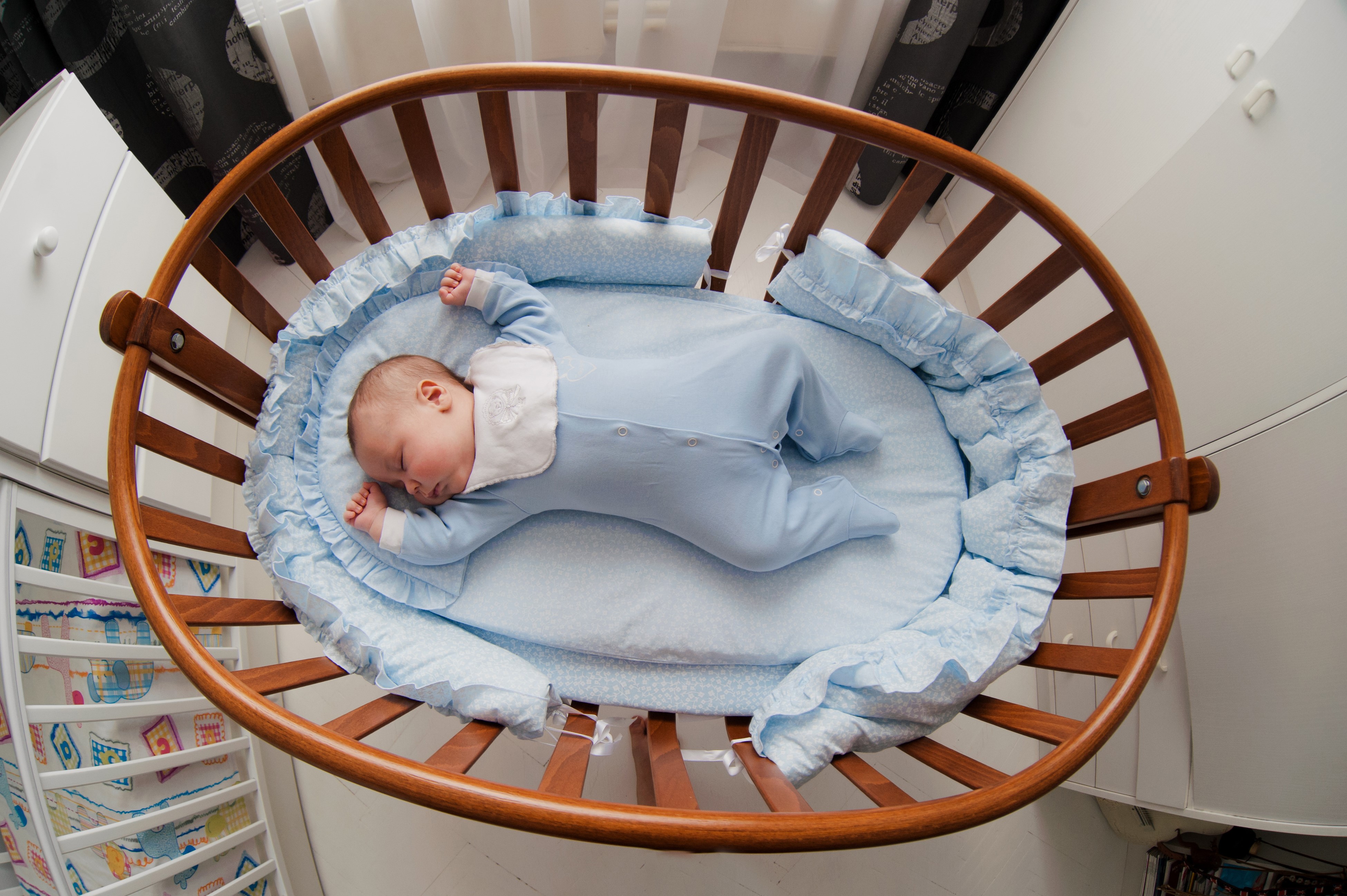 Baby sleeping in a crib HD Wallpaper
