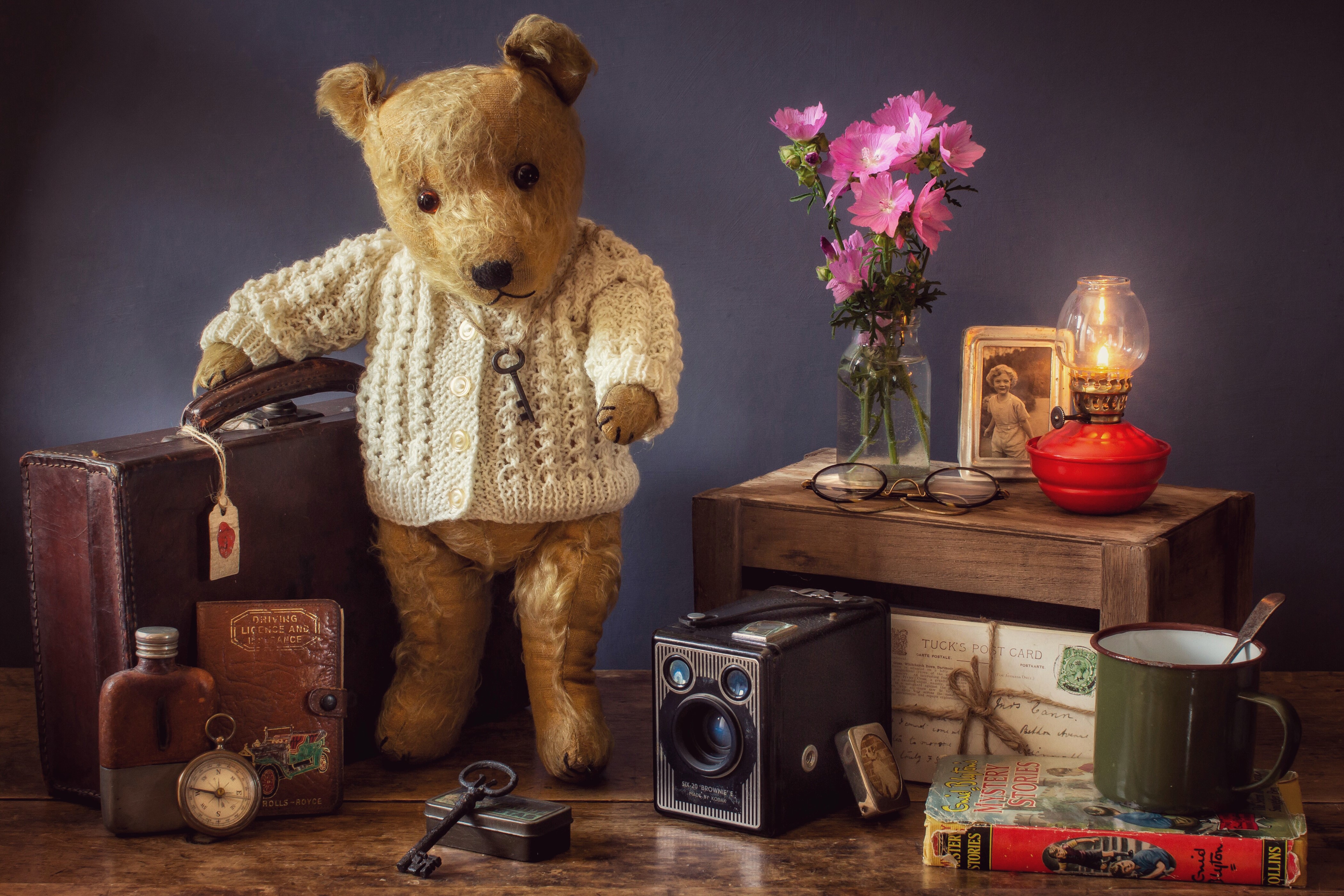 Still-life with Teddy Bear, Suitcase, and Books HD Wallpaper