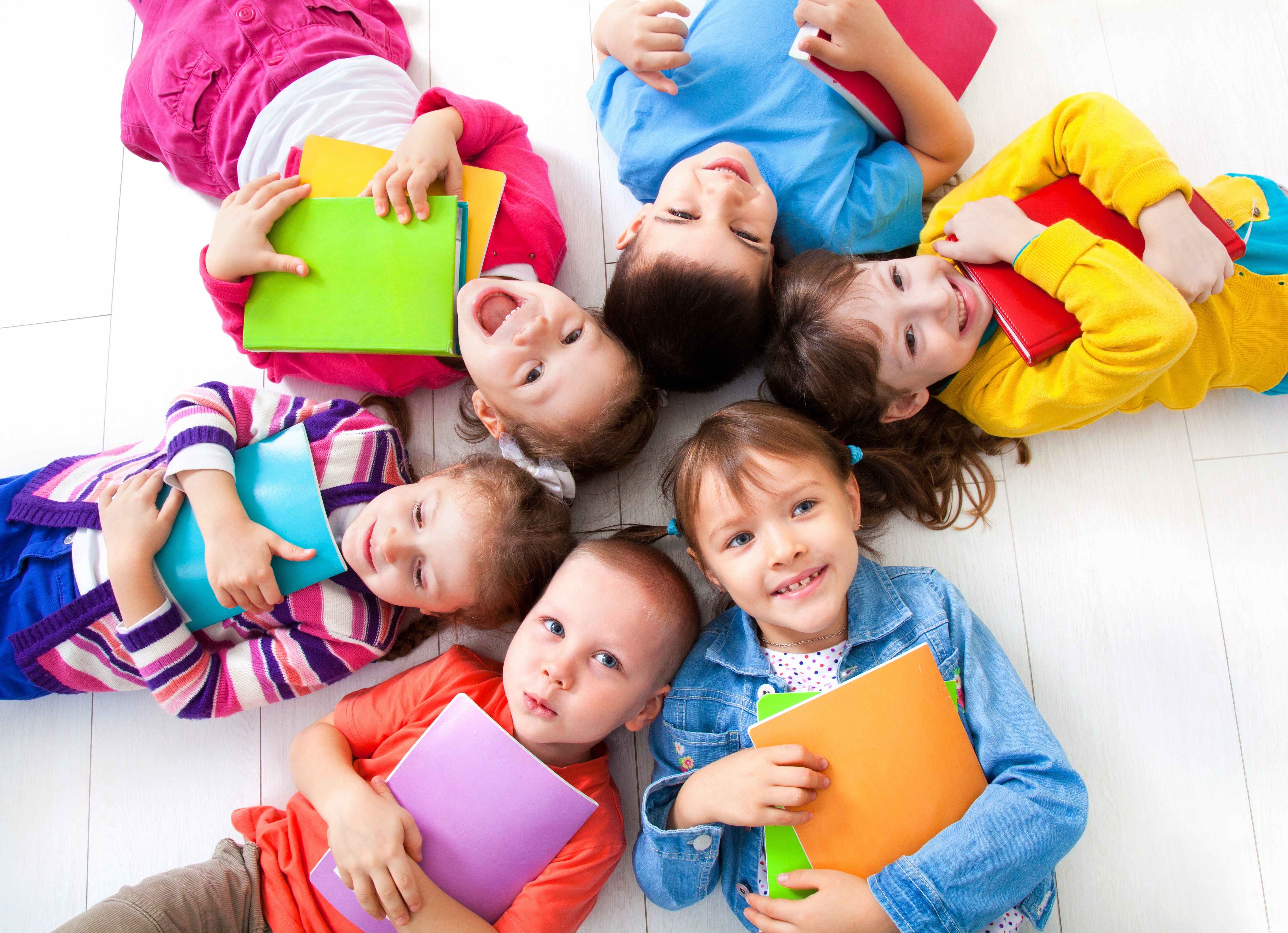 Children Lying Down with Books HD Wallpaper