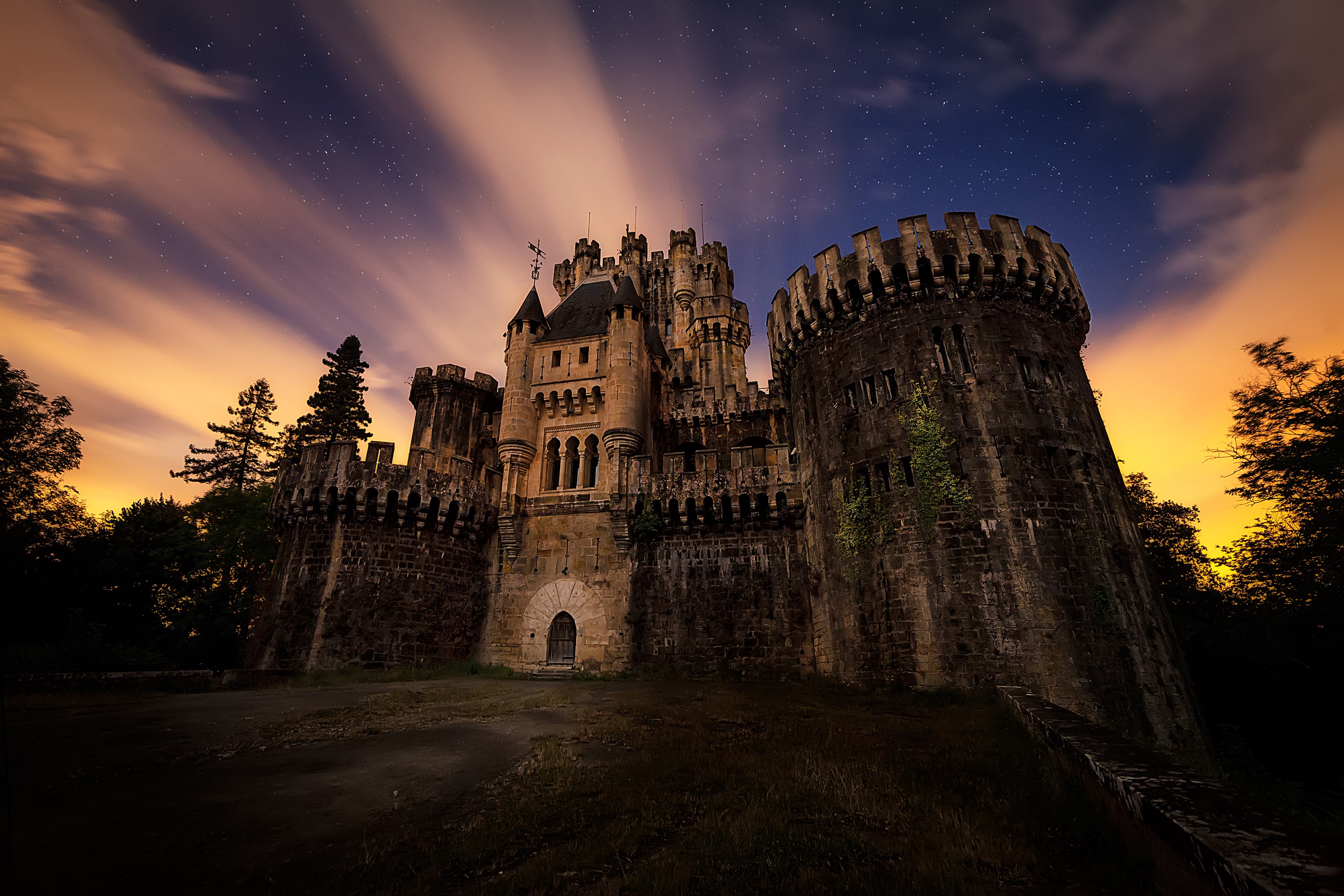 Butron Castle at night with stars and clouds HD Wallpaper