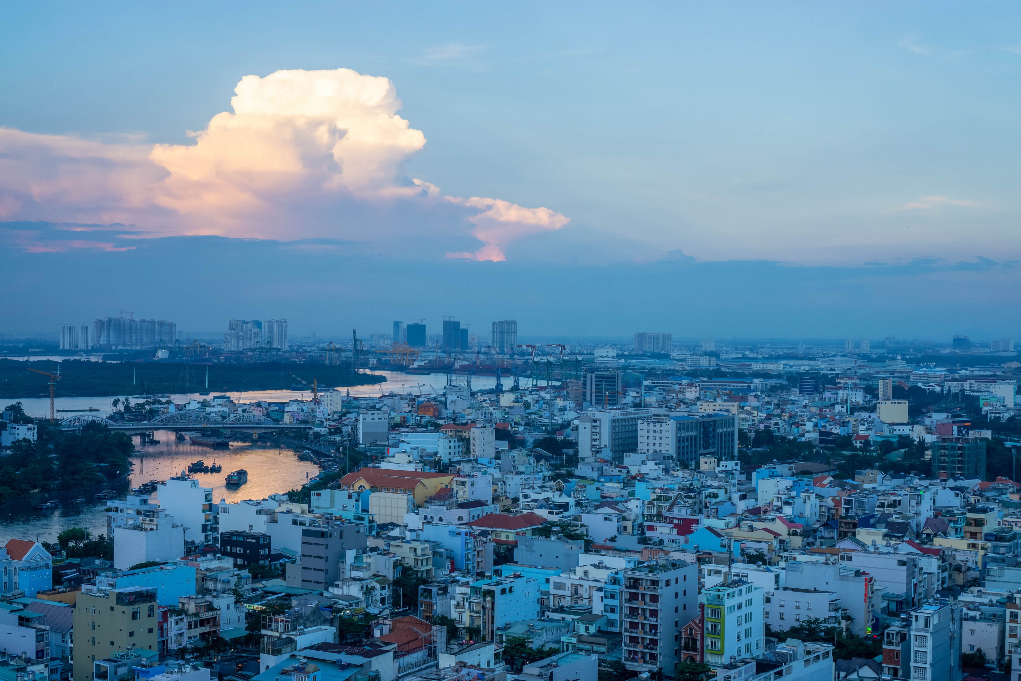 Ho Chi Minh City skyline at dusk with river HD Wallpaper