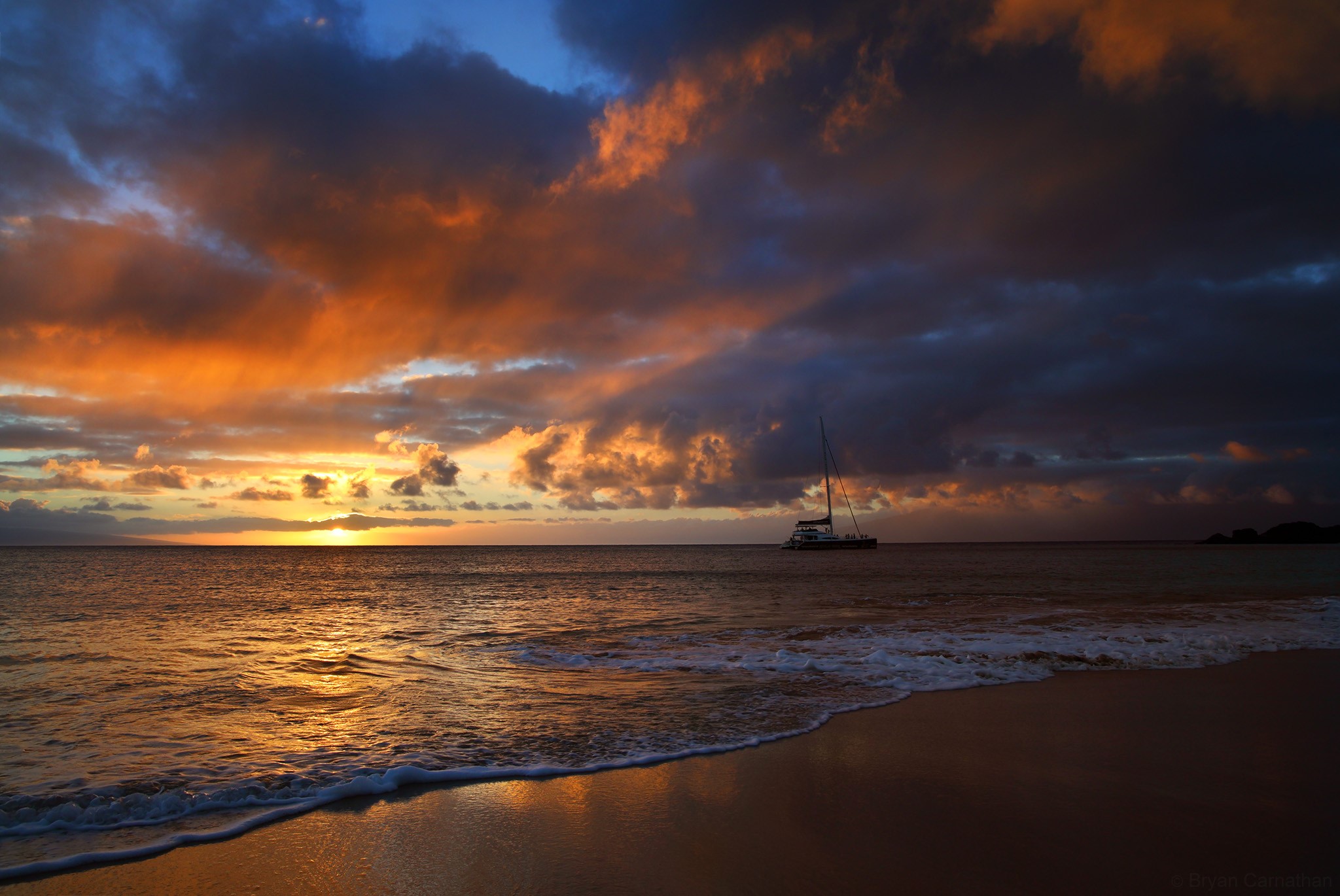 Sunset over the ocean with a catamaran HD Wallpaper