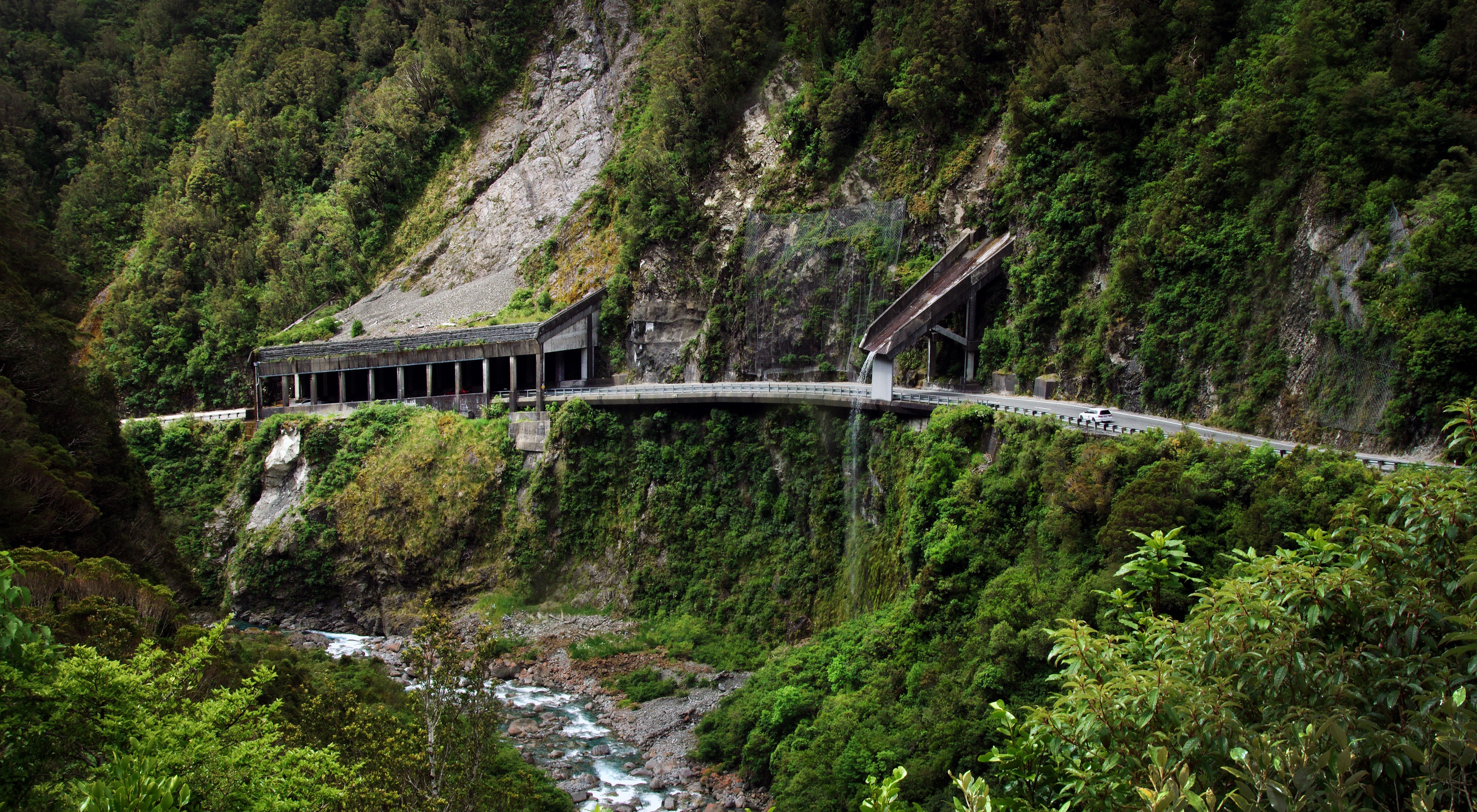 Road through a gorge with old tunnels in New Zealand HD Wallpaper