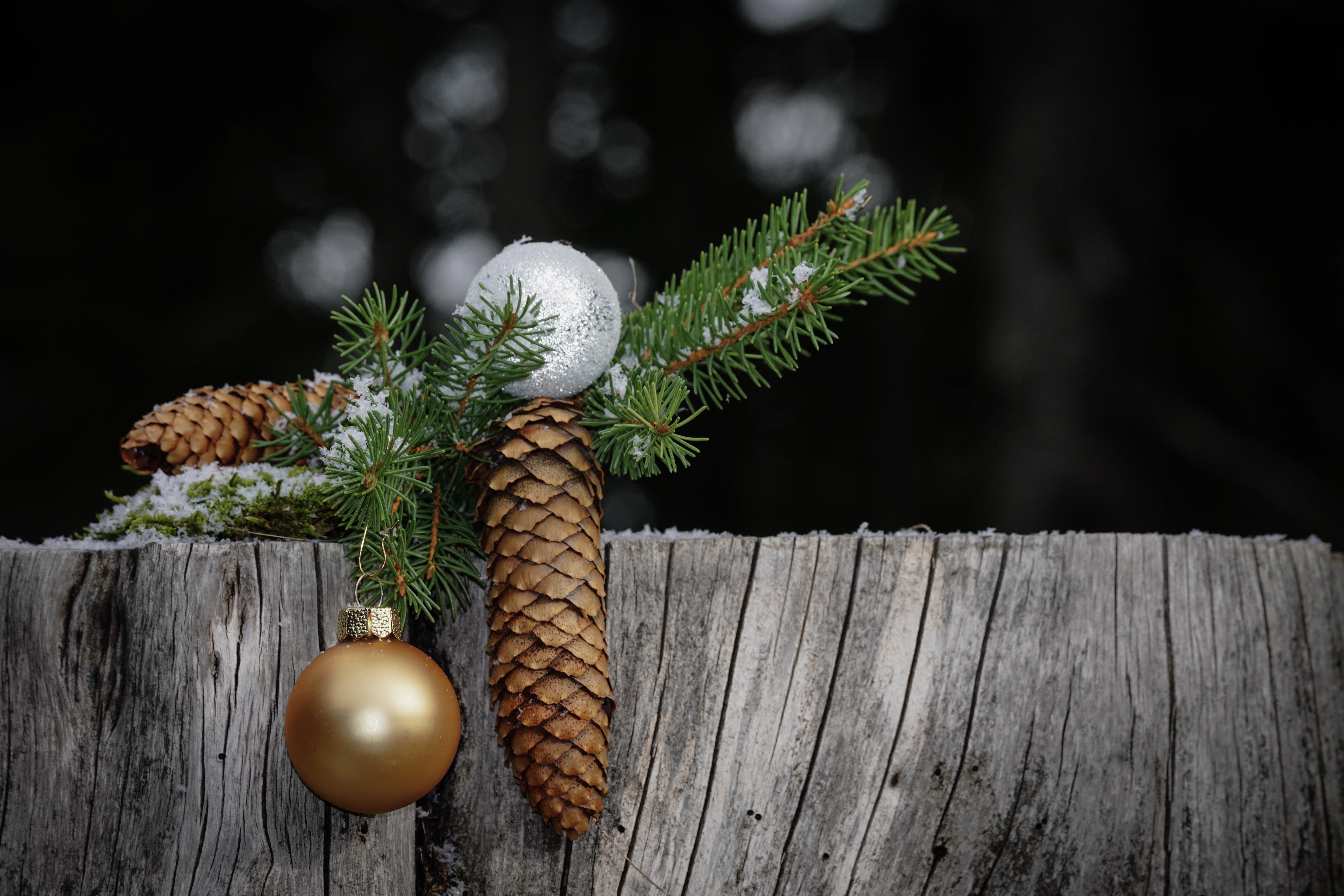 Christmas pine cones and ornaments on wood HD Wallpaper