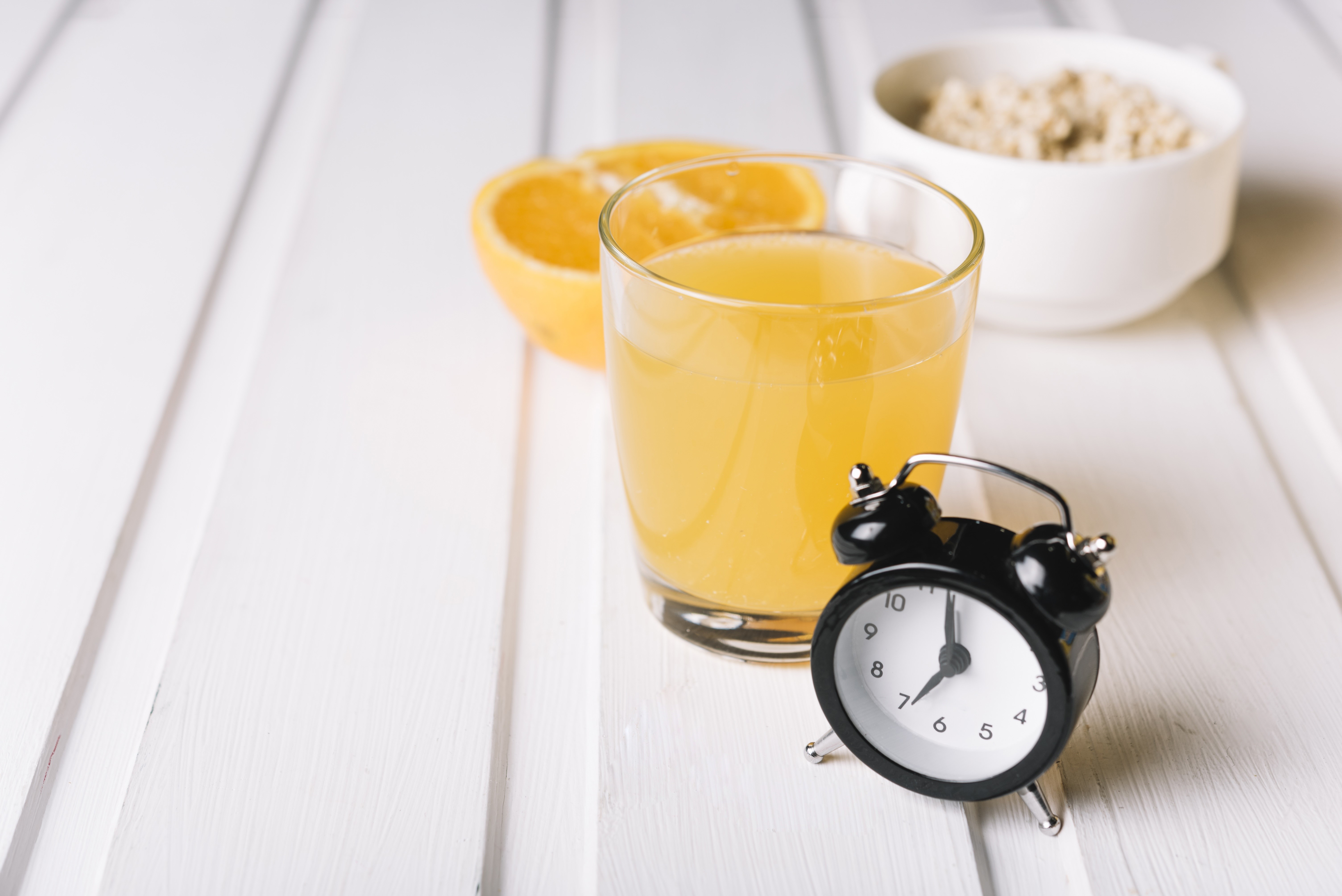 Alarm clock with orange juice and oatmeal HD Wallpaper