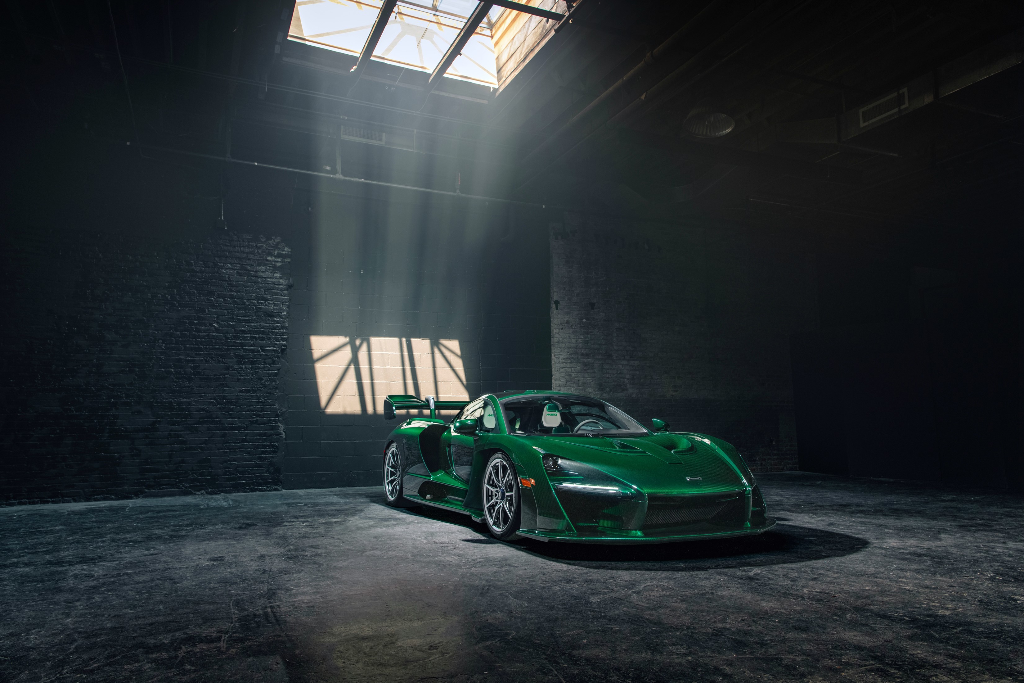 Green McLaren Senna in a dark garage HD Wallpaper