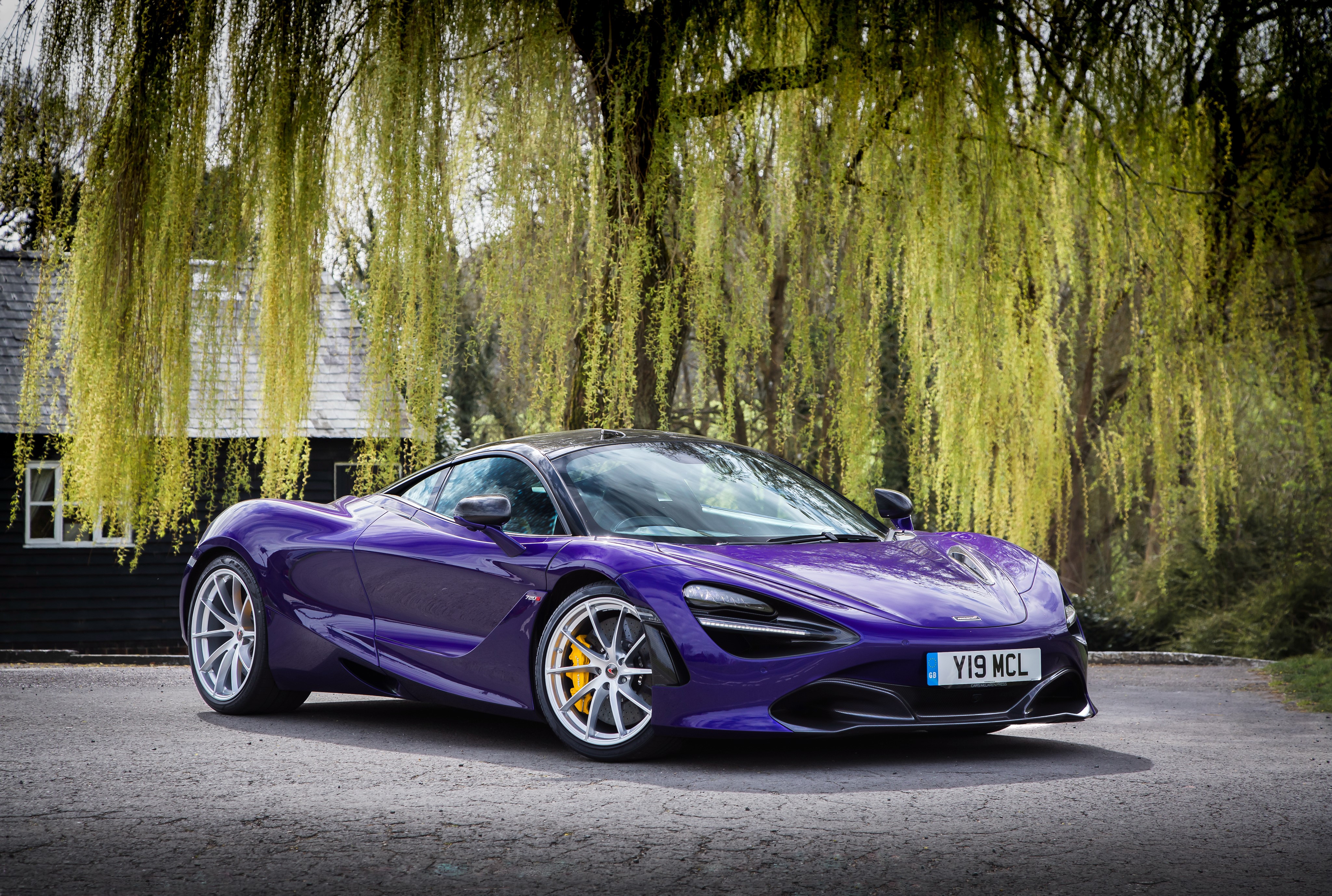 Violet McLaren 720S Coupe parked near a house HD Wallpaper